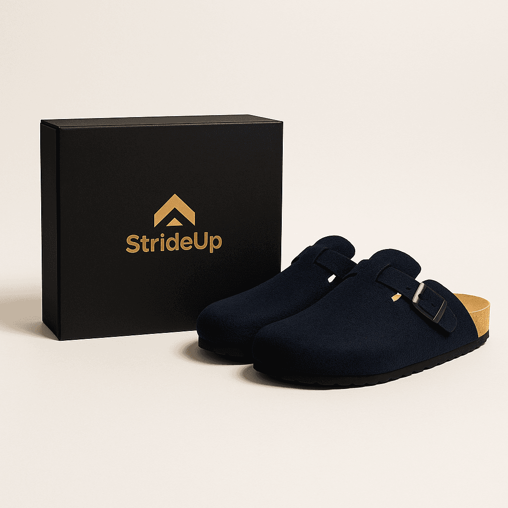 Smiling man wearing a turquoise t-shirt and white overshirt, confidently adjusting his collar against a teal-blue studio backdrop.