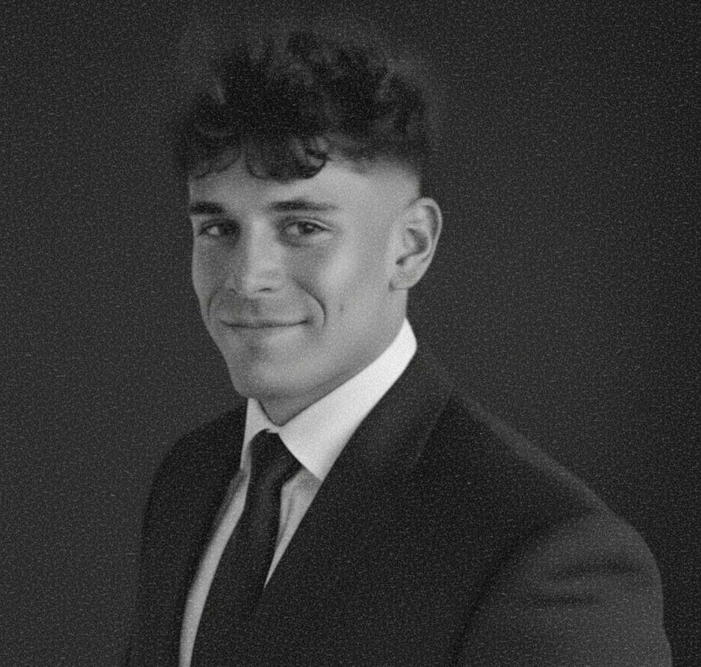 image of man wearing glasses folding his arms