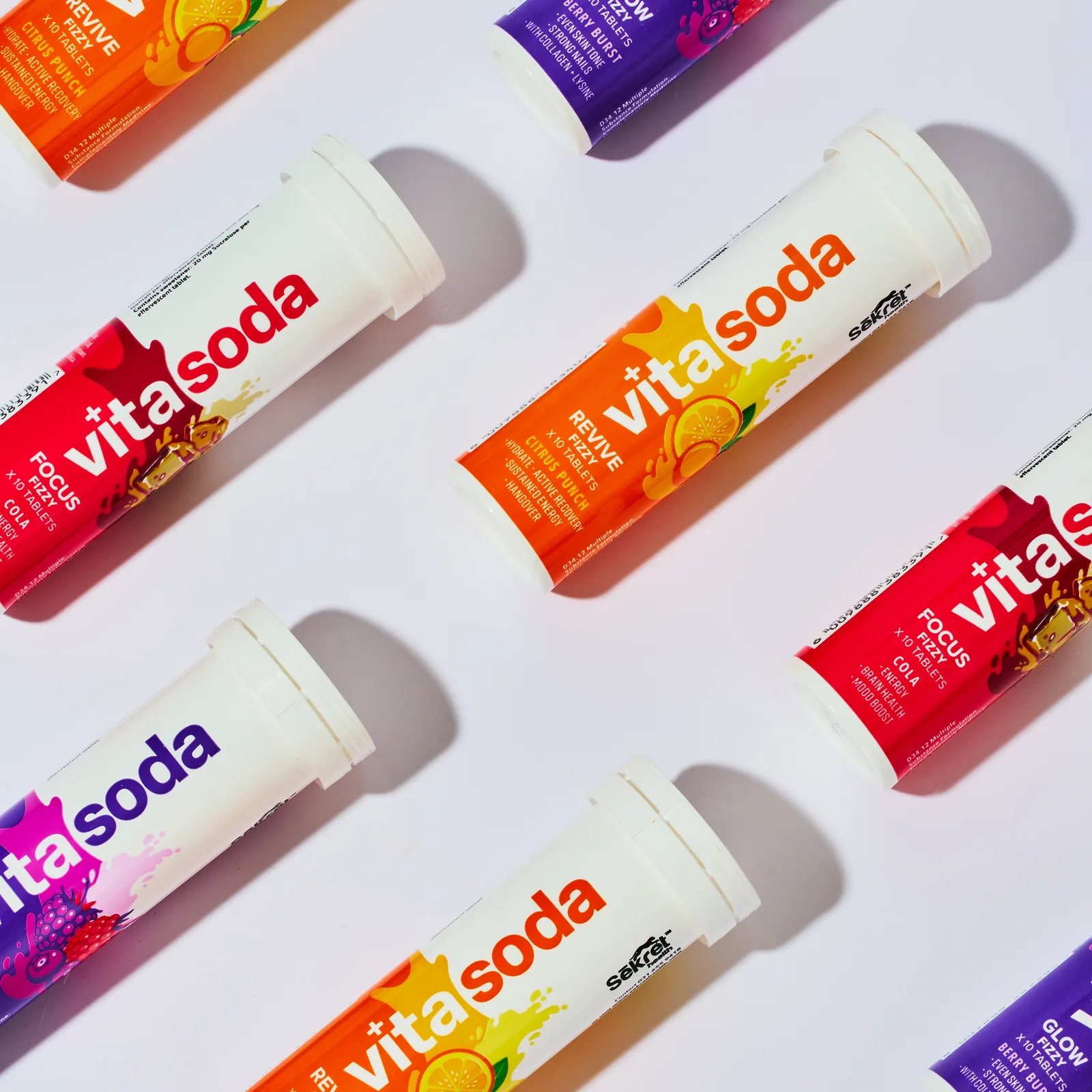 Vita Soda Focus, Glow and Revive tubes laid in a diagonal pattern on white
