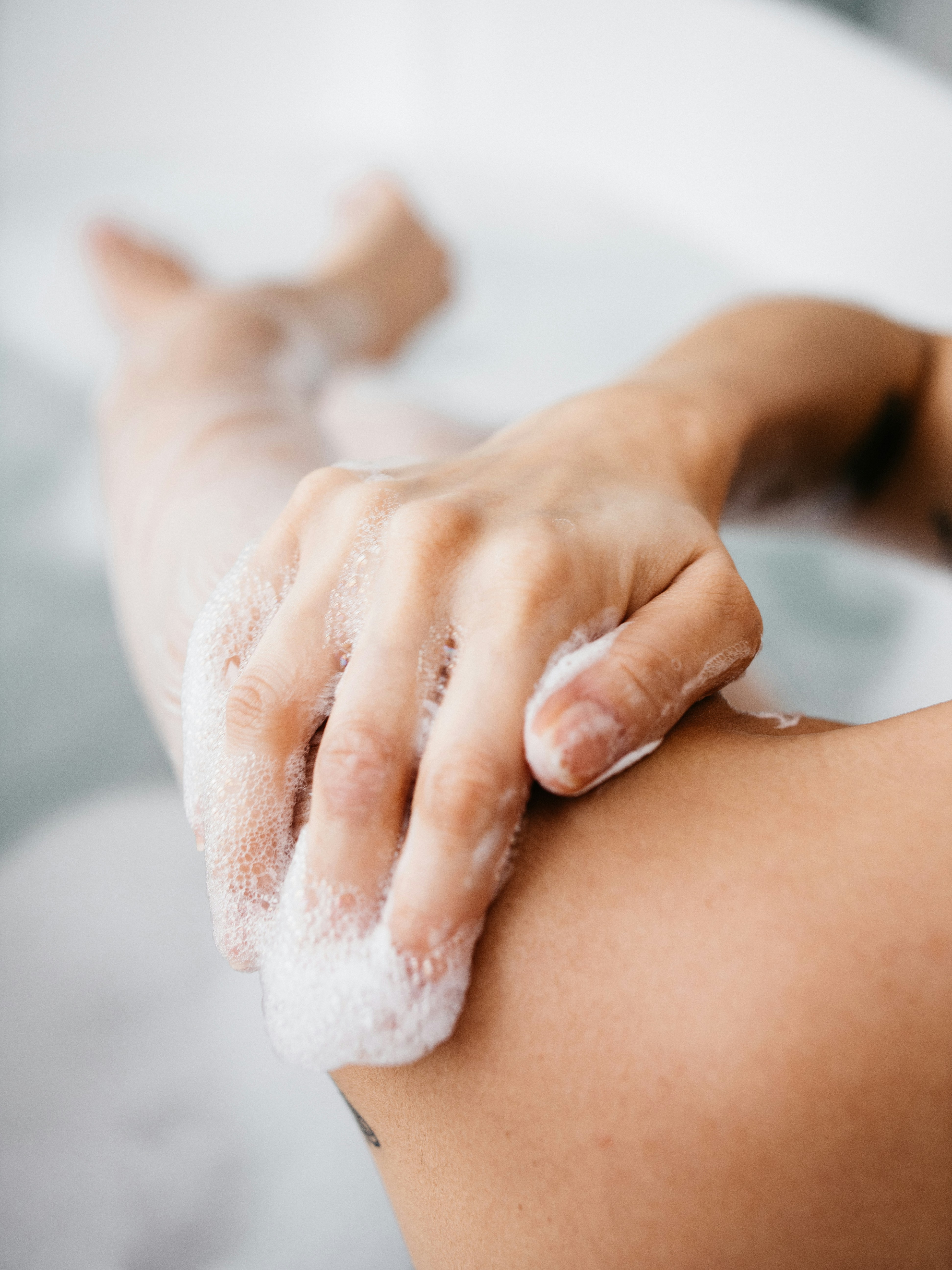 Lathering soap suds on arm