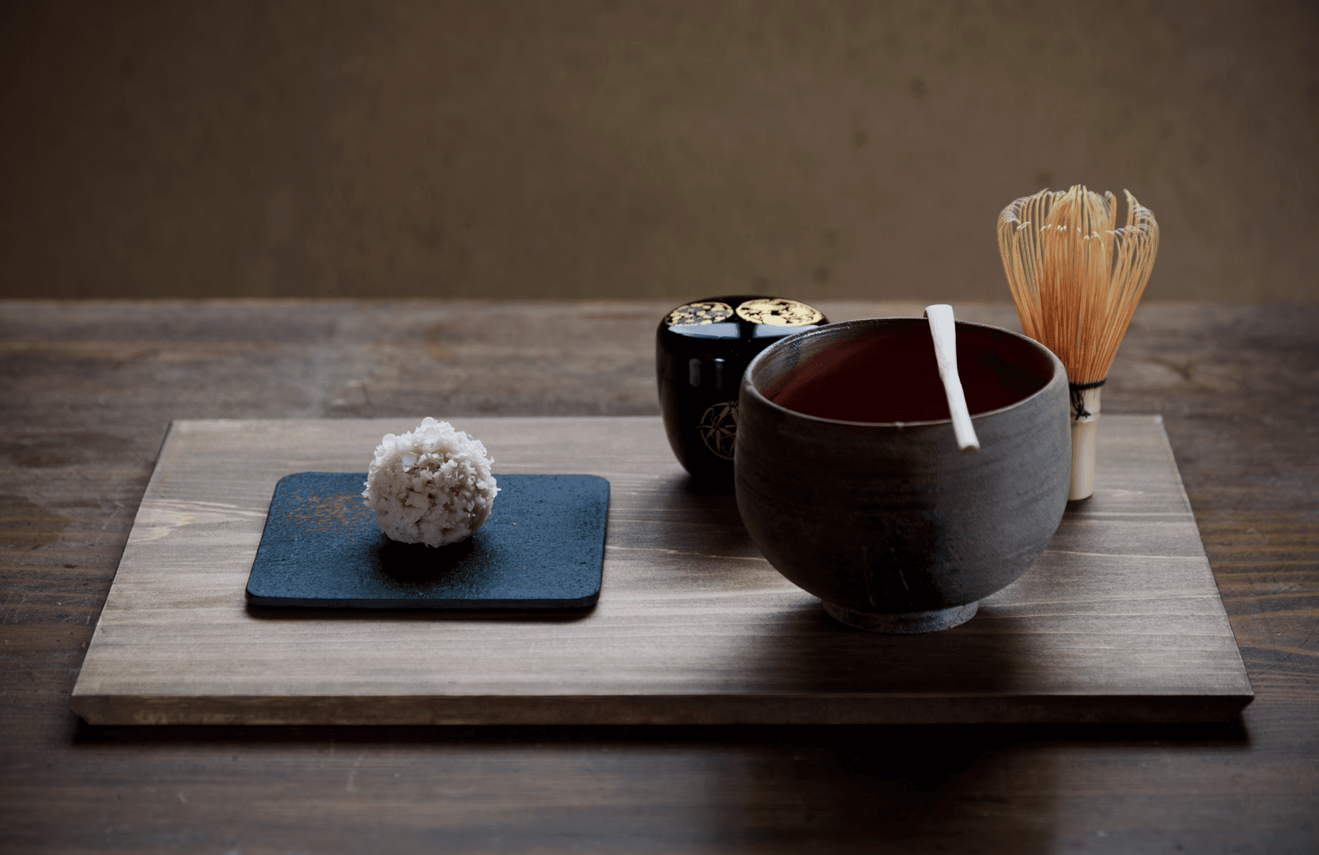 Japanese matcha and sweet served on a wooden tray