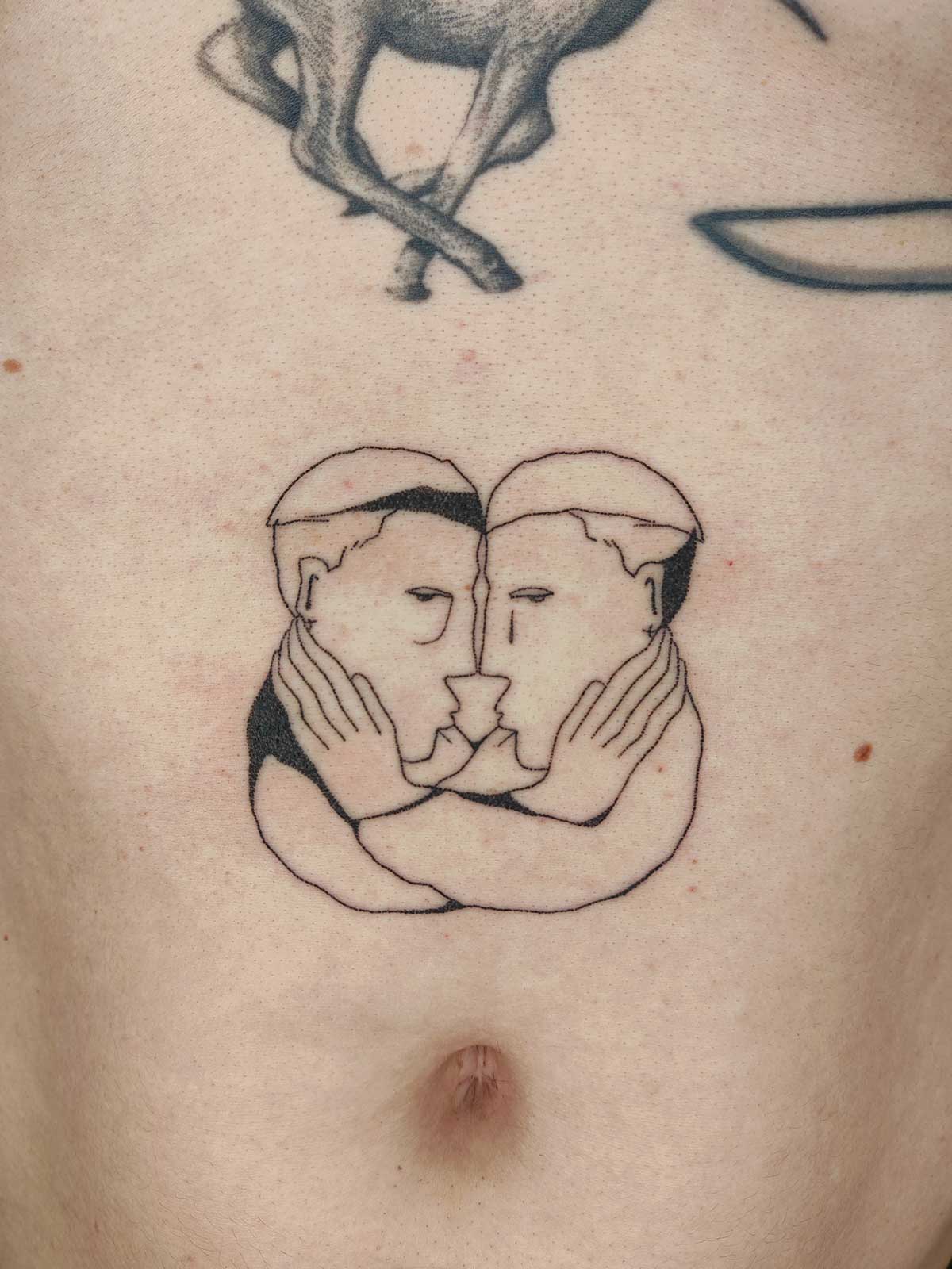 two faces tattoo