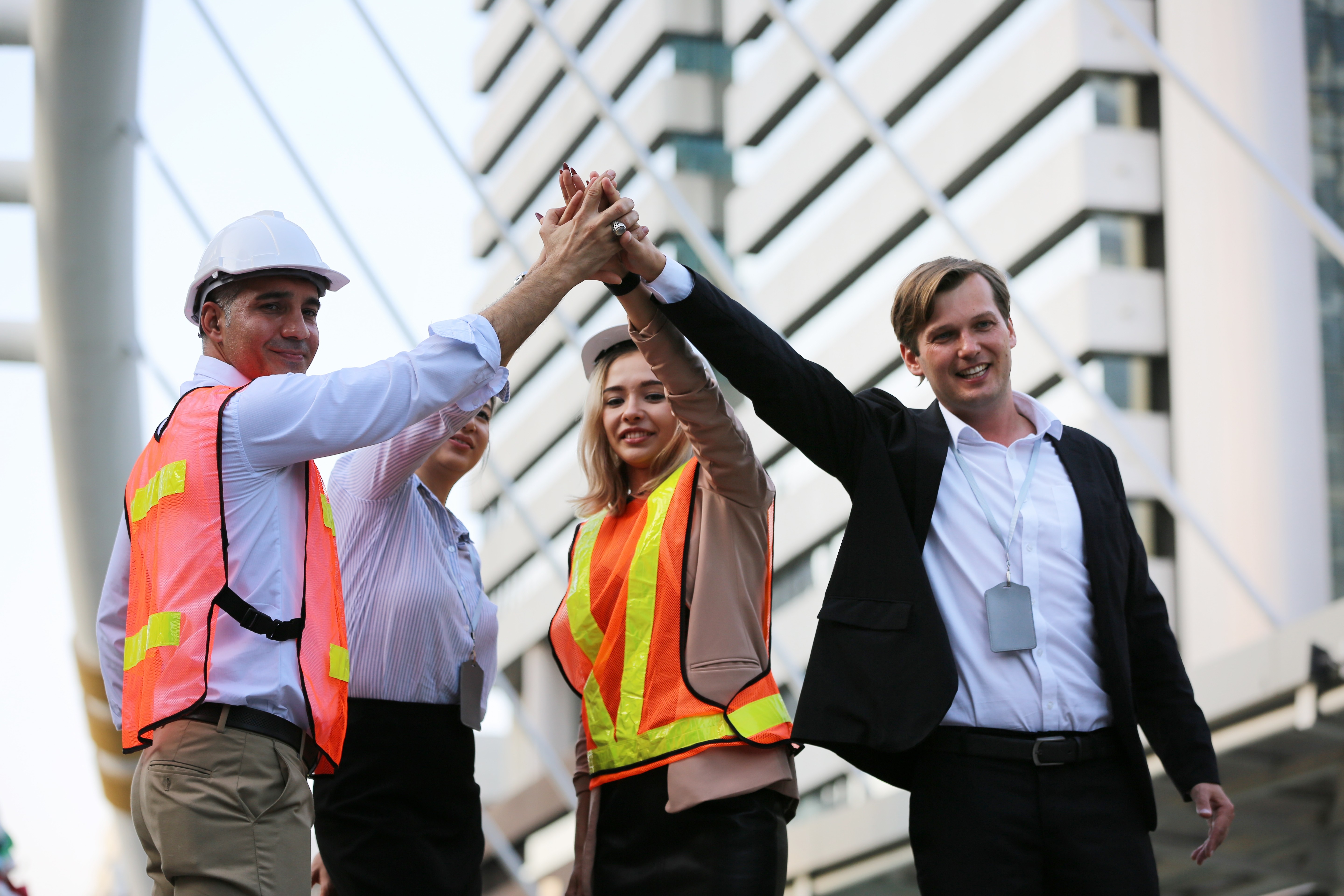 Construction leadership and project team celebrating commercial growth, representing construction marketing, construction digital marketing, and marketing for construction companies.