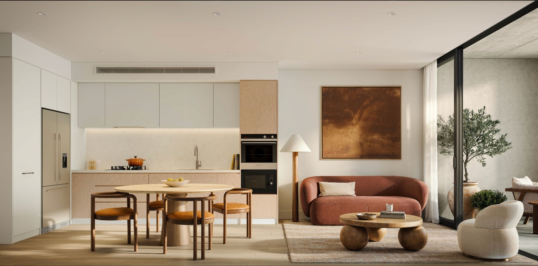 Stylish open-plan apartment interior at The Avenues by Deicorp, combining kitchen, dining, and living spaces with modern finishes and private balcony.