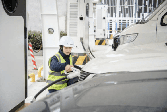 Image of technician doing field service at electric vehicle charging station
