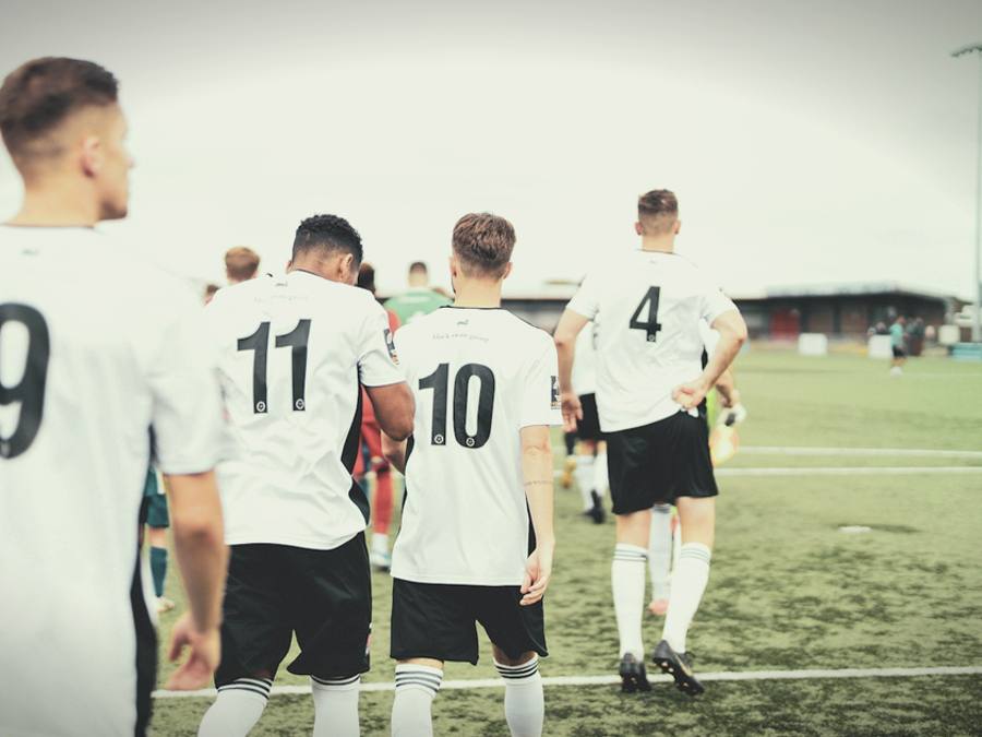 Players walking onto the pitch
