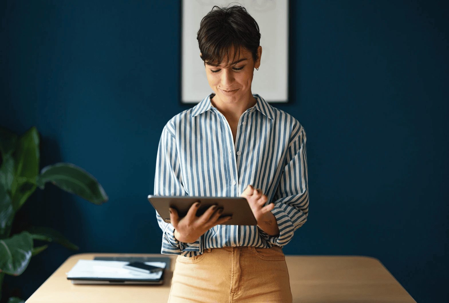 Professional managing tasks on a tablet with TickedOff solutions