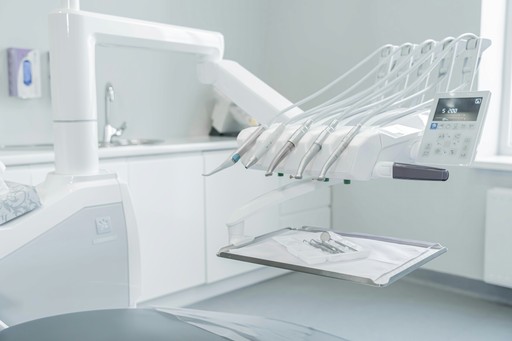 A hospital room with a bed and a mirror