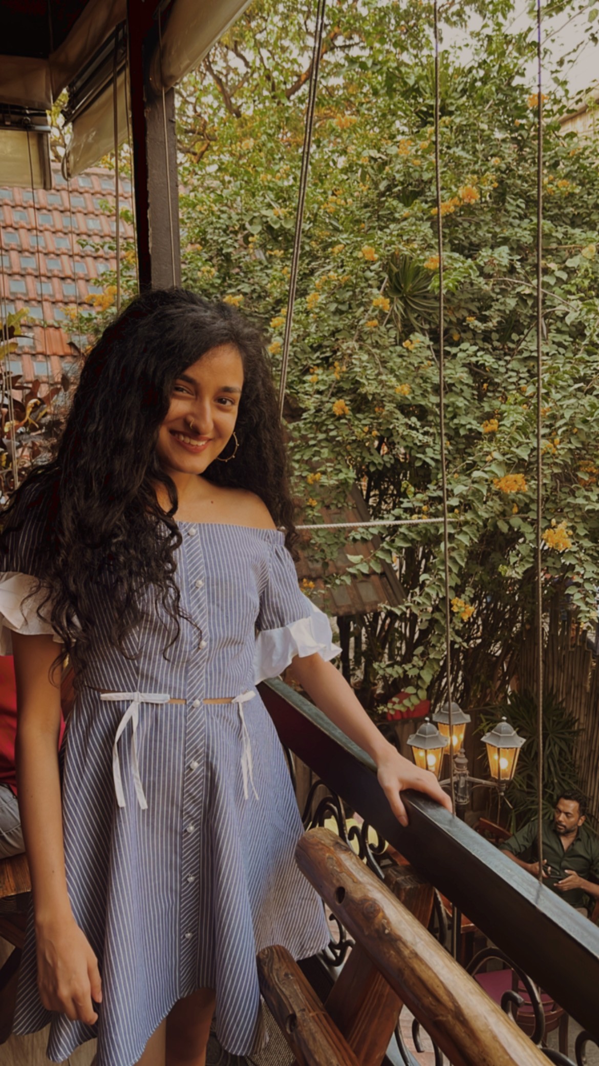man filming on beach