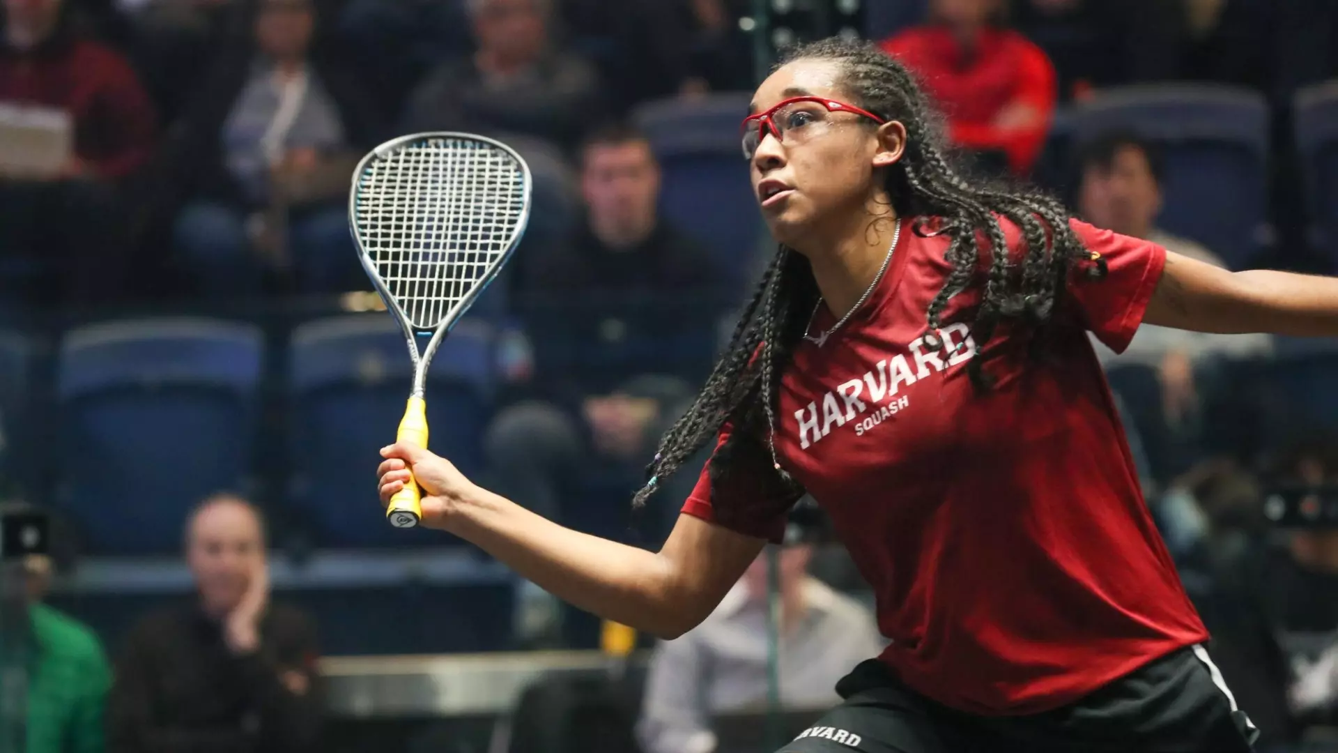 An empty glass-walled squash court