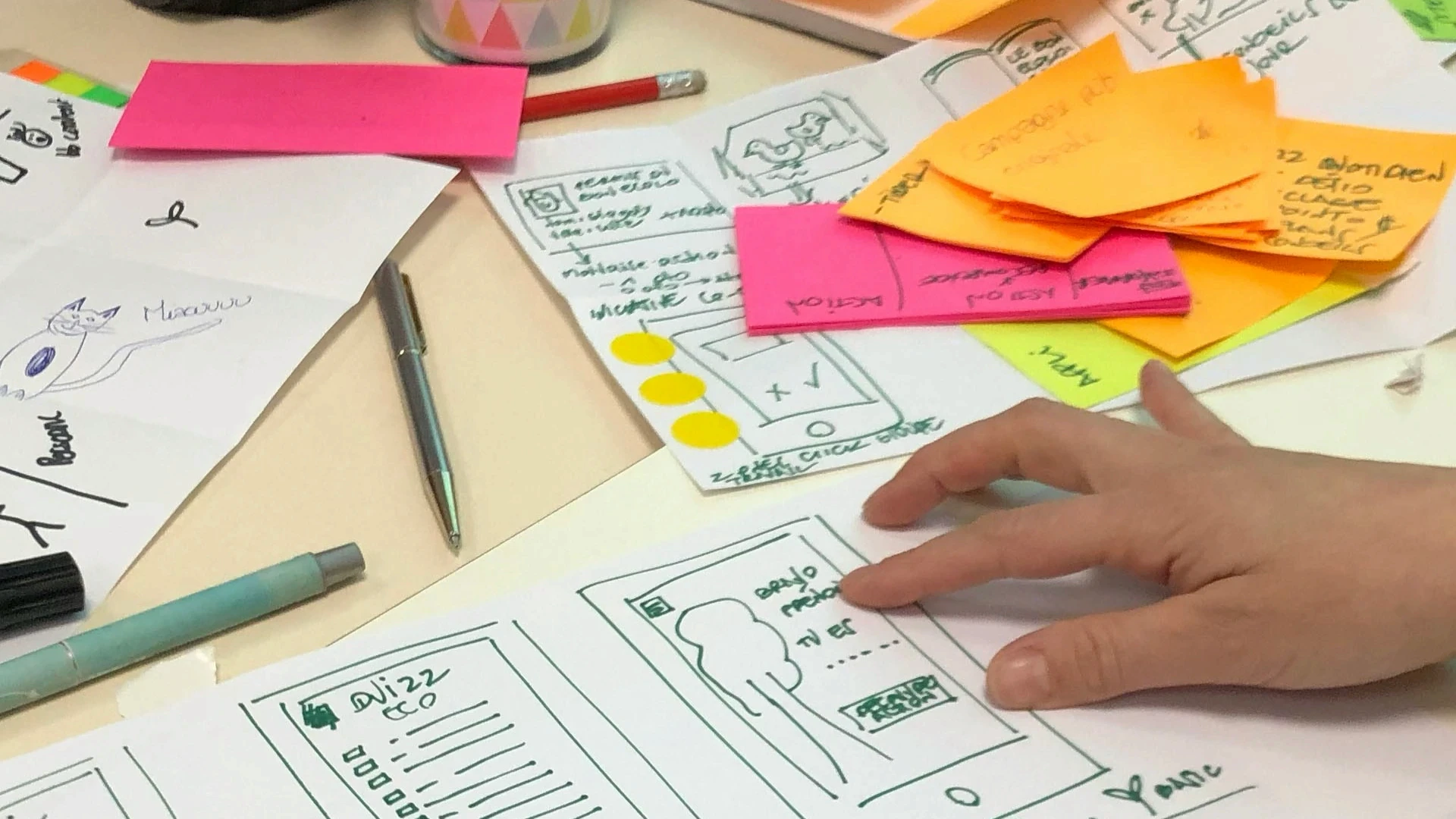 person writing on printing paper