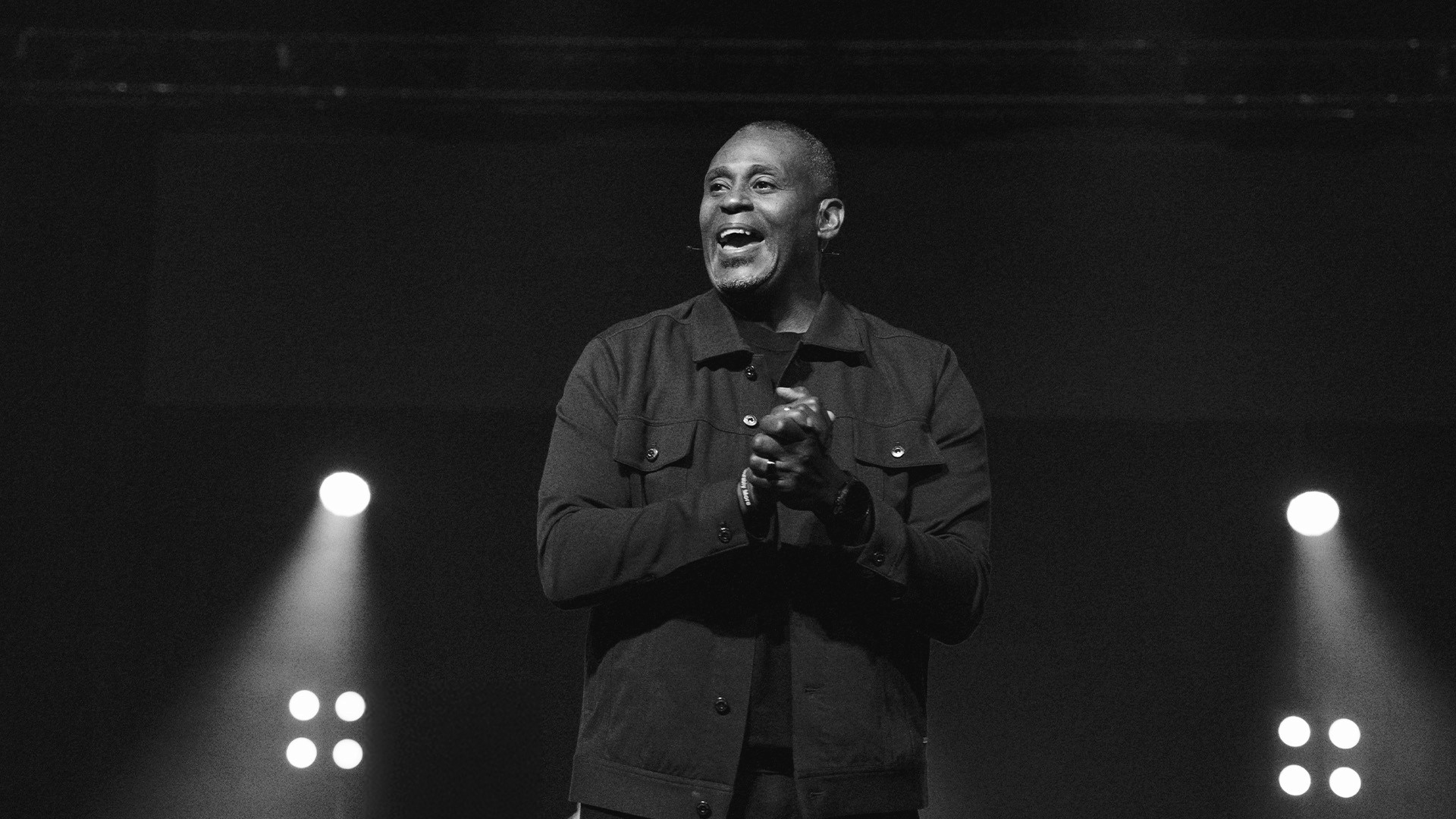 two people looking at a tablet and smiling