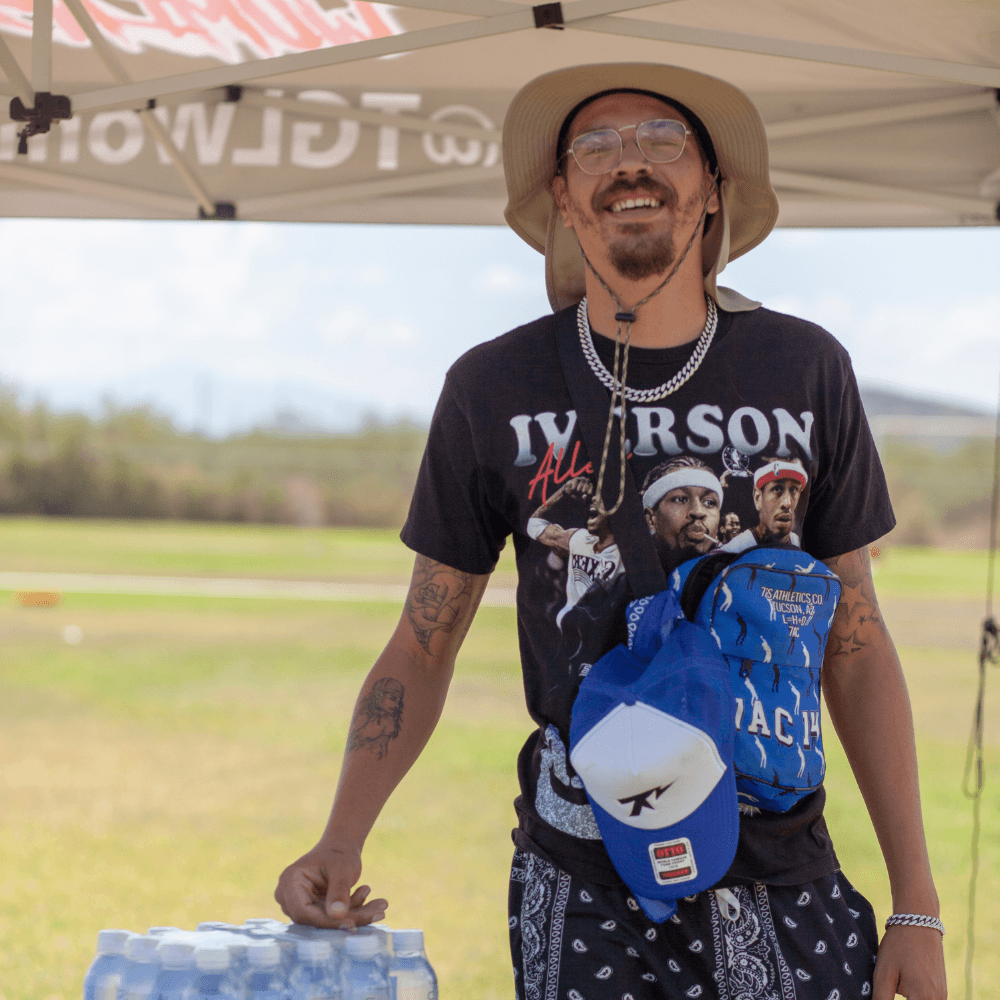 smiling woman wearing white and black pinstriped collared top