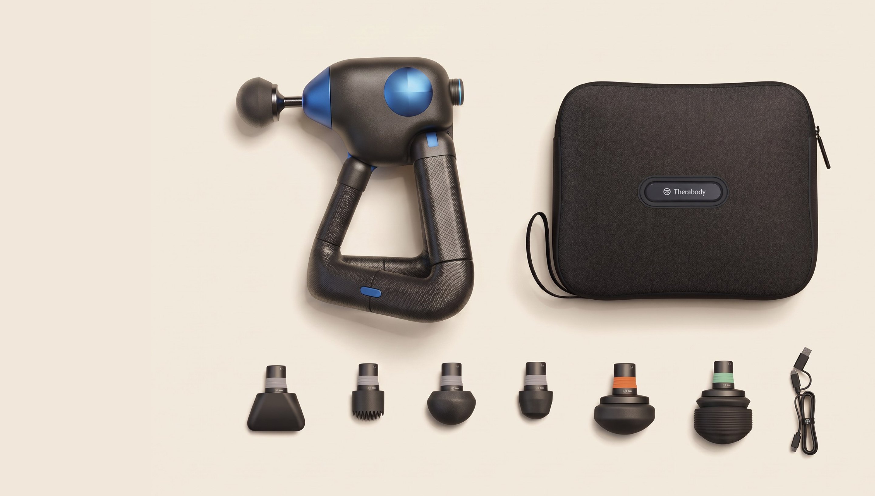 Week-14 flat lay: Theragun Core with six heads, a cable and the carry case