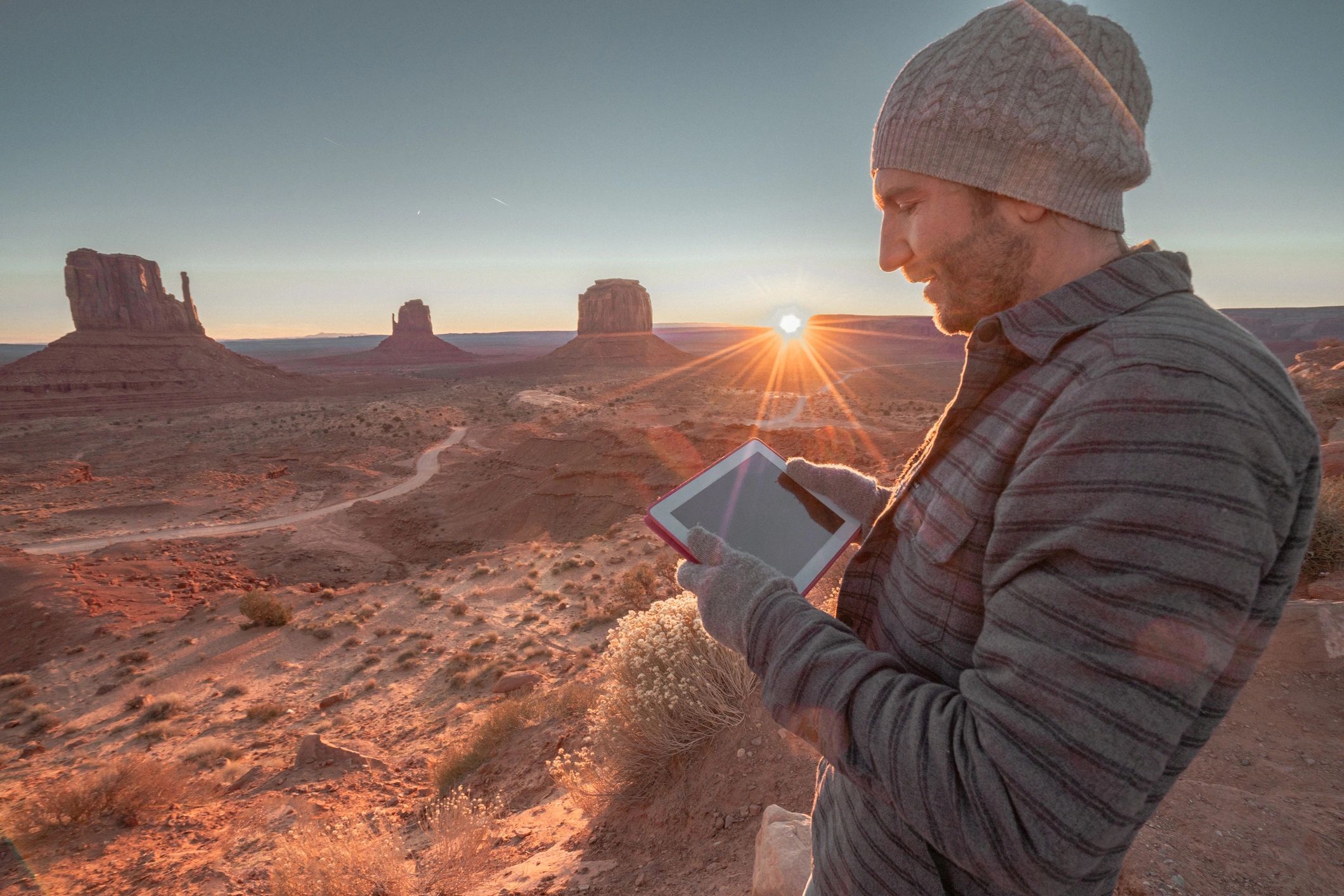 a black and white living room with a large tv