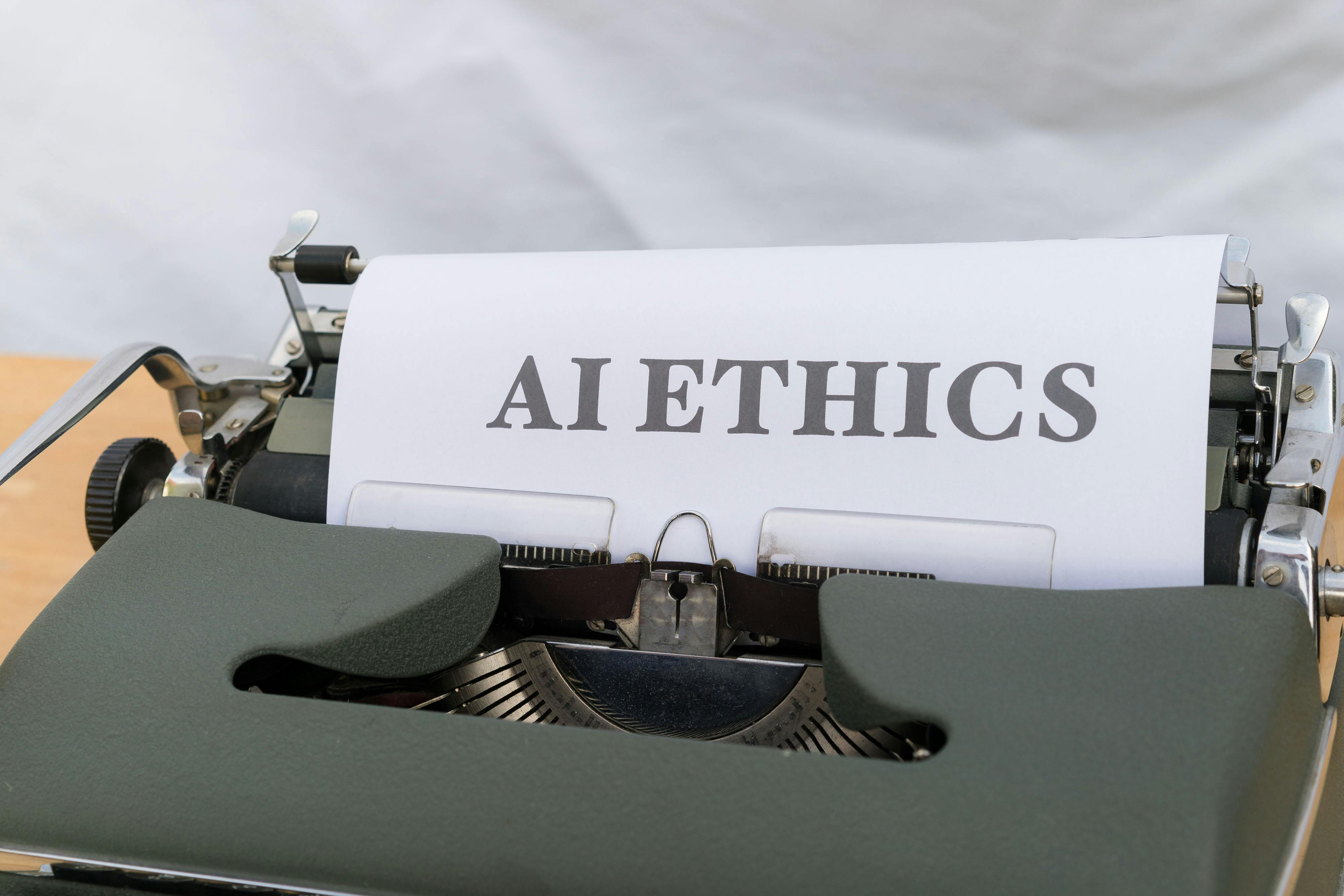 Close-up of a typewriter printing the words ‘AI Ethics,’ highlighting the importance of Ethical AI Use in technology.
