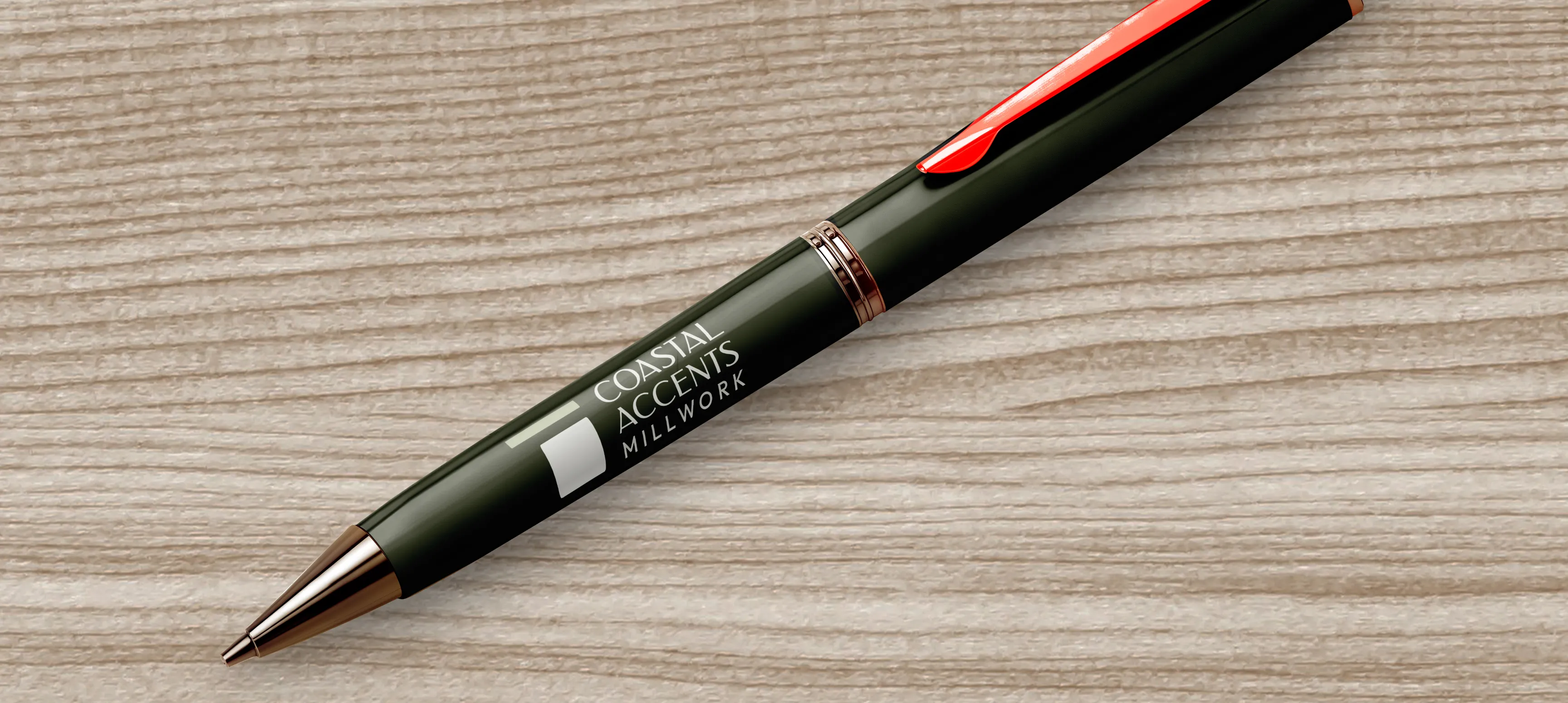 A green pen with the Coastal Accents logo.