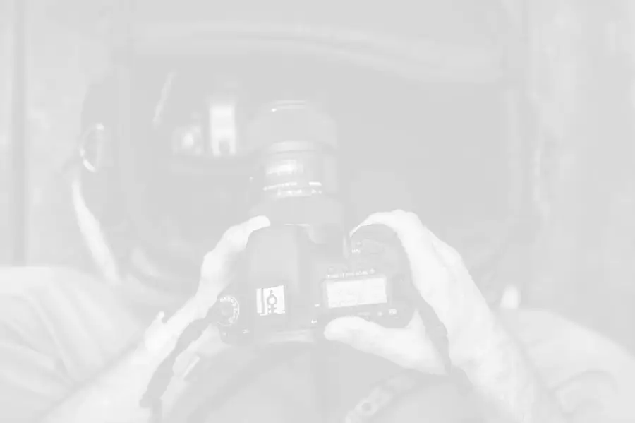 volume-photographer-holding-camera-background