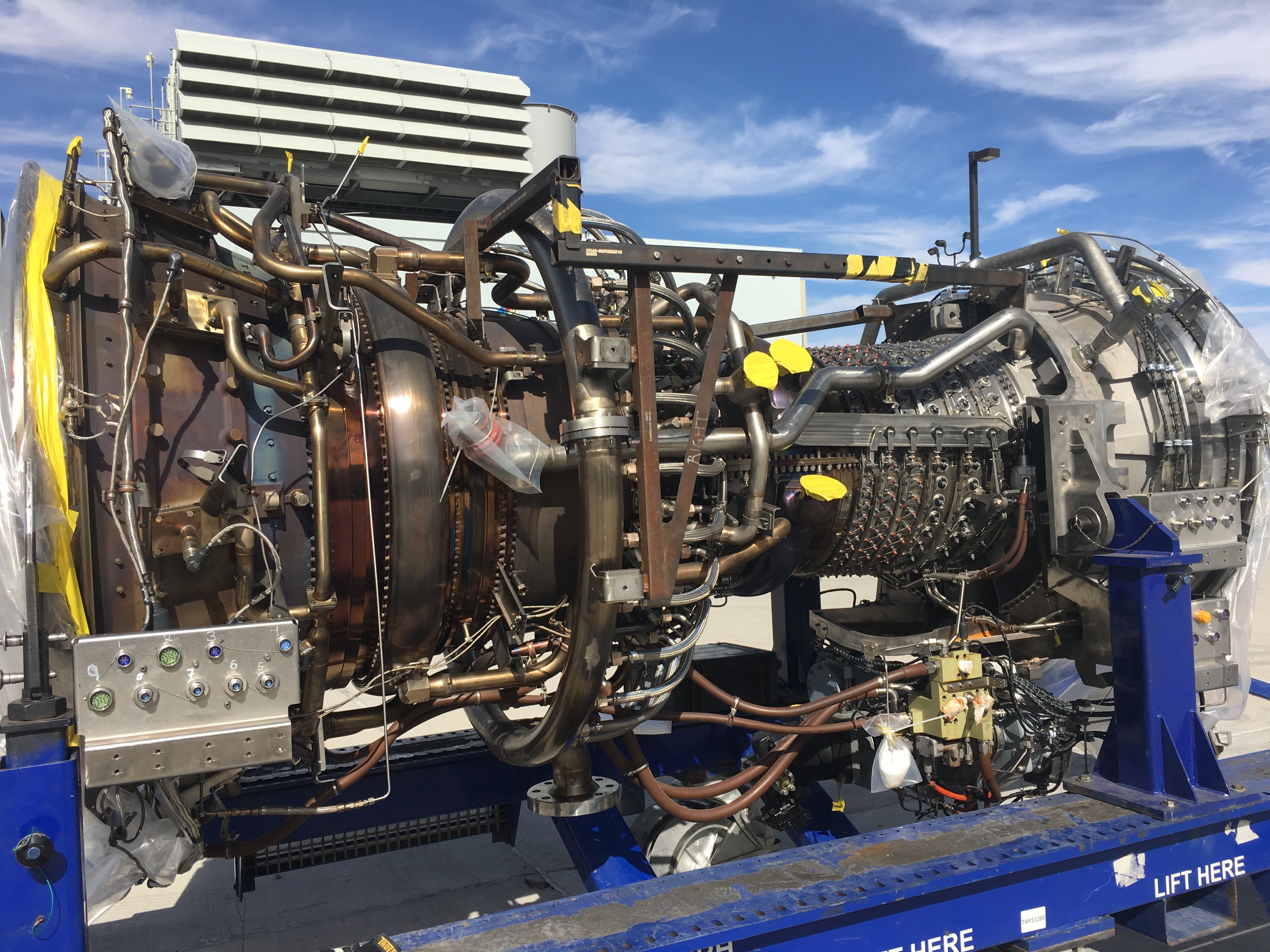 Gas turbine engine with visible inlet and exhaust components used in power plants