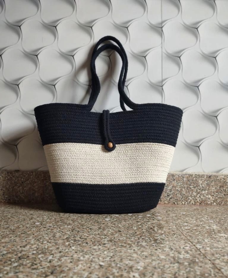 Handwoven striped jute tote bag with button closure