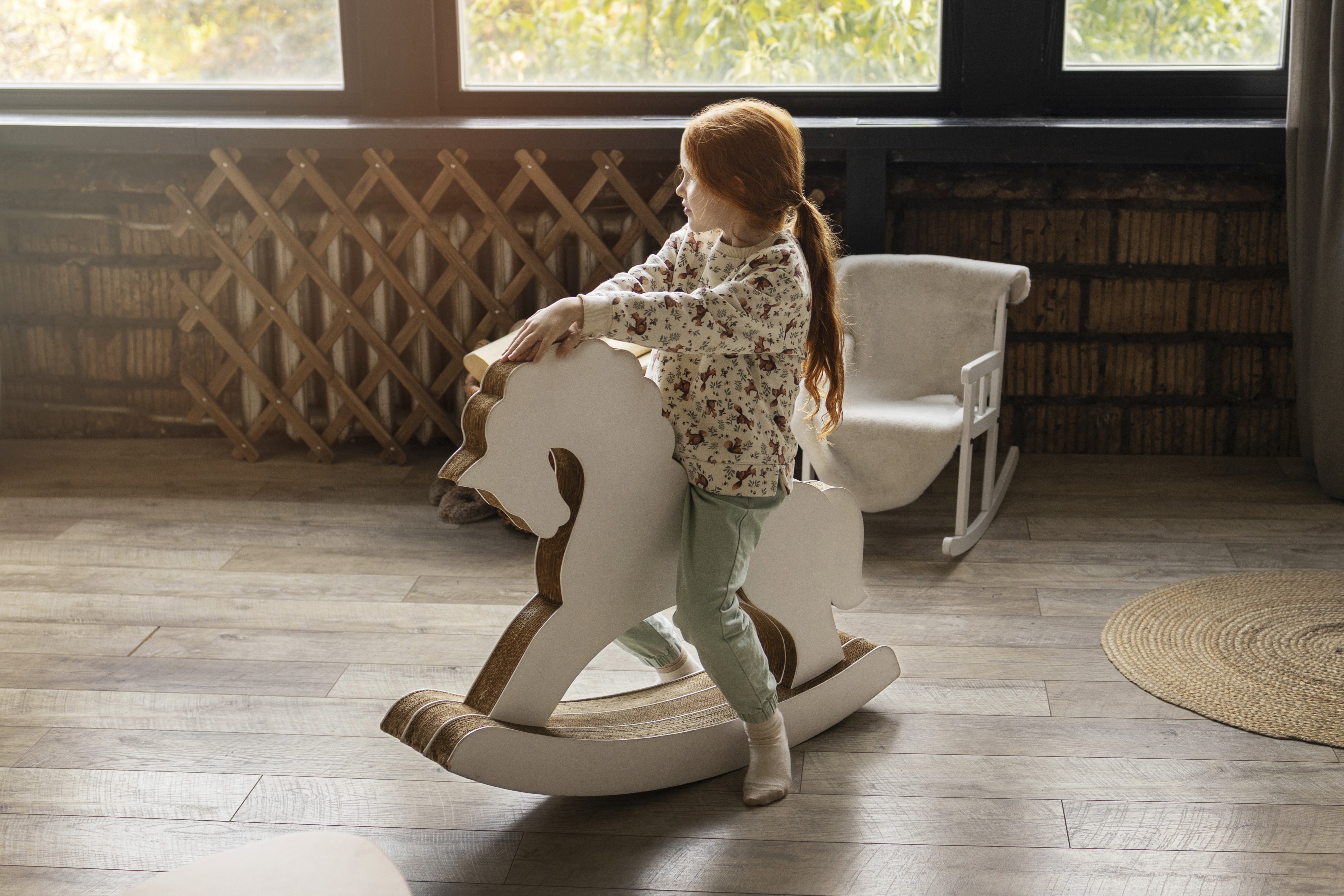 A young child plays safely on LUXO’s wood-look hybrid flooring, highlighting a durable, child-friendly, and easy-clean surface designed for everyday comfort in Australian homes.