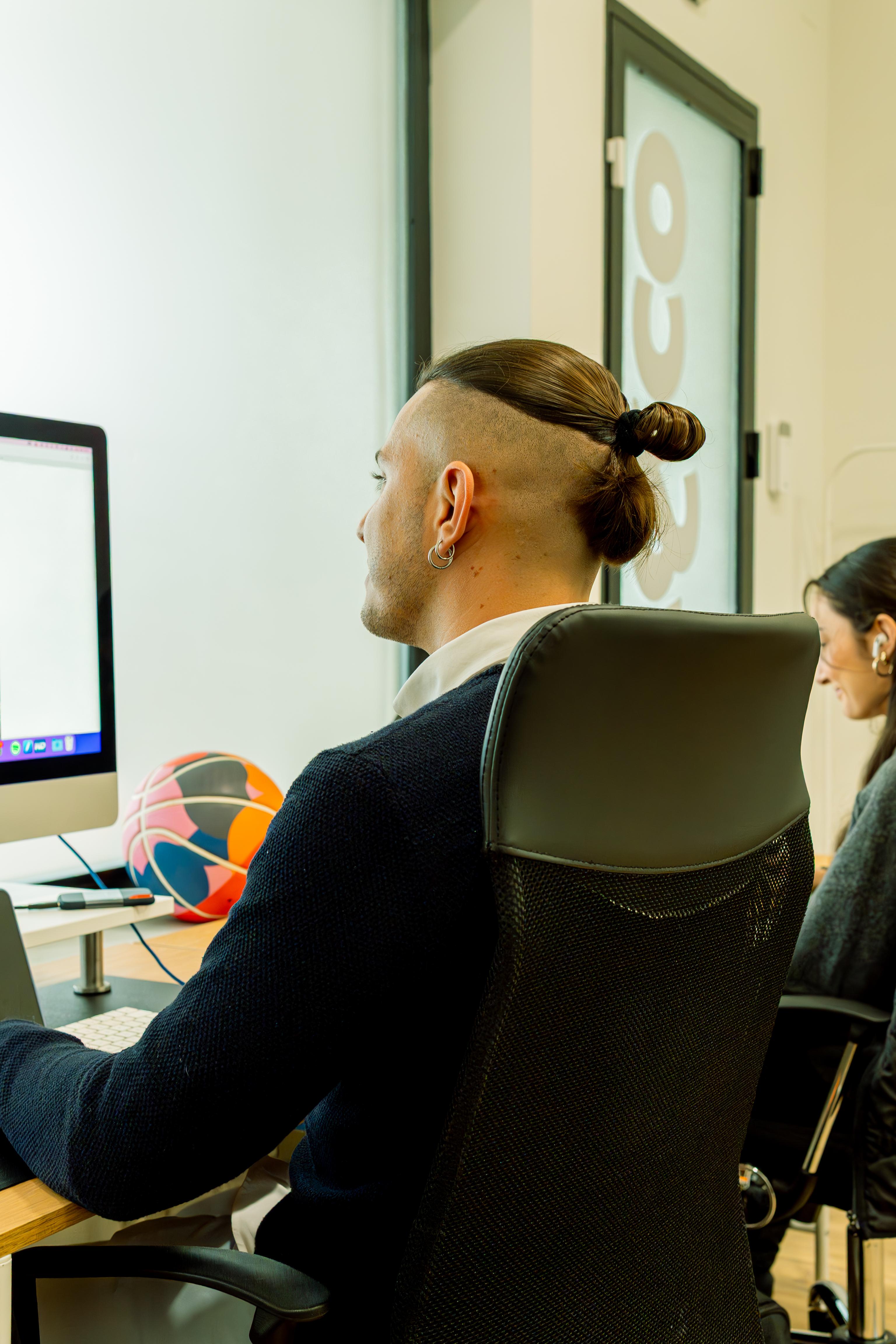 Young designer writing on a billboard