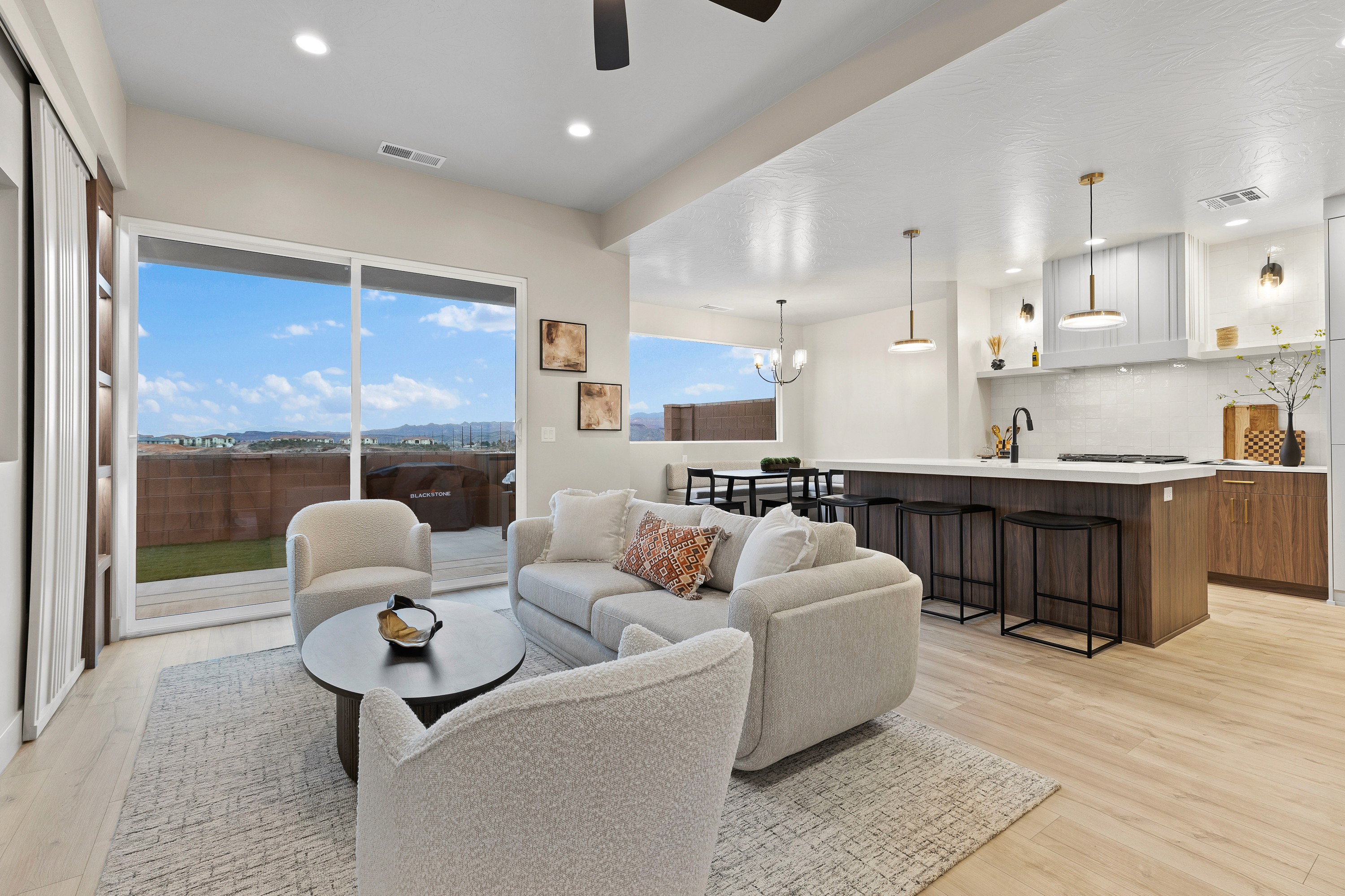  View from the great room toward the kitchen and dining area in The Painted Horizon twin home in Hurricane, Utah, highlighting the open layout and functional design.