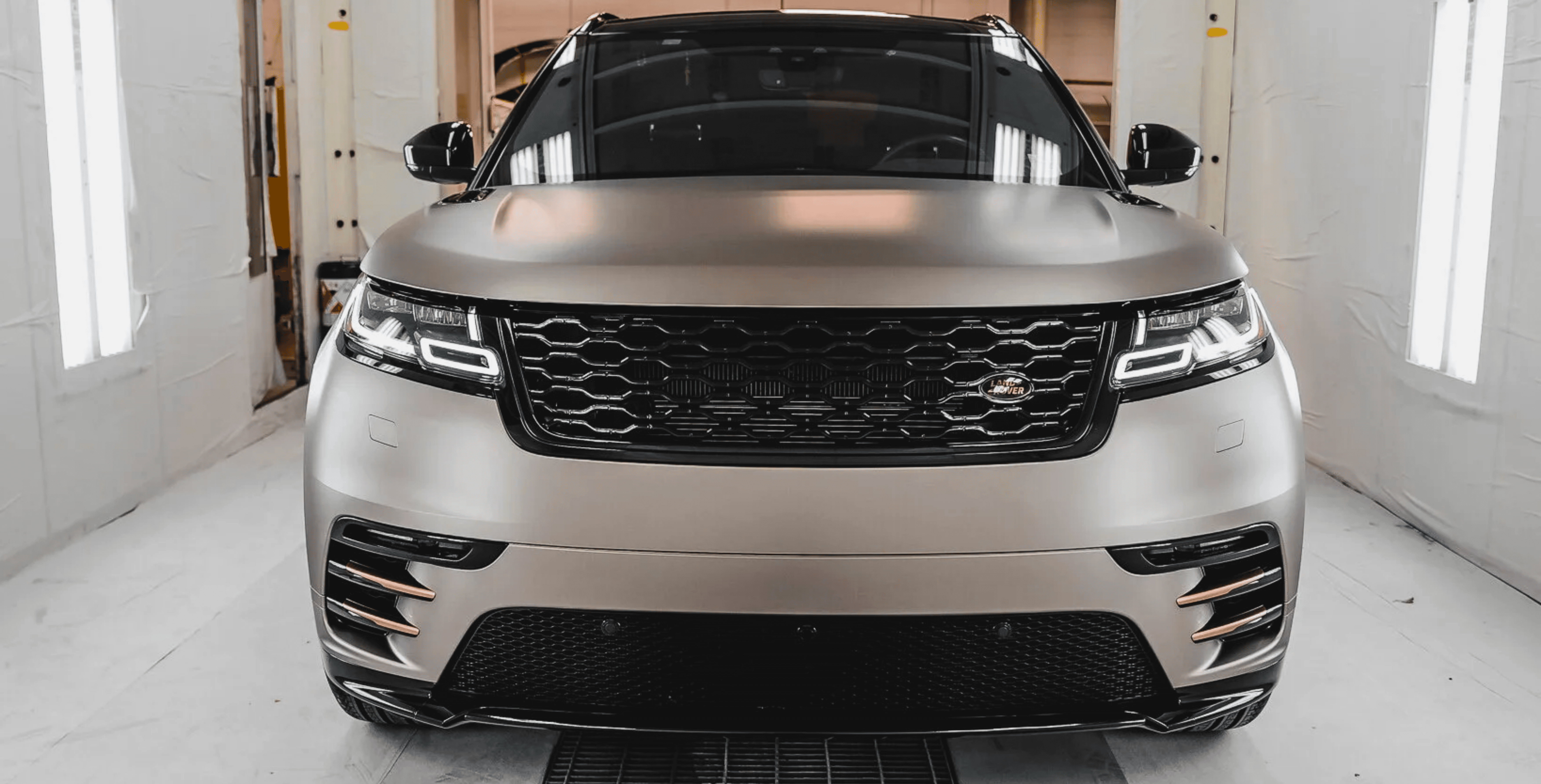 An orange cube-shaped side table is shown.