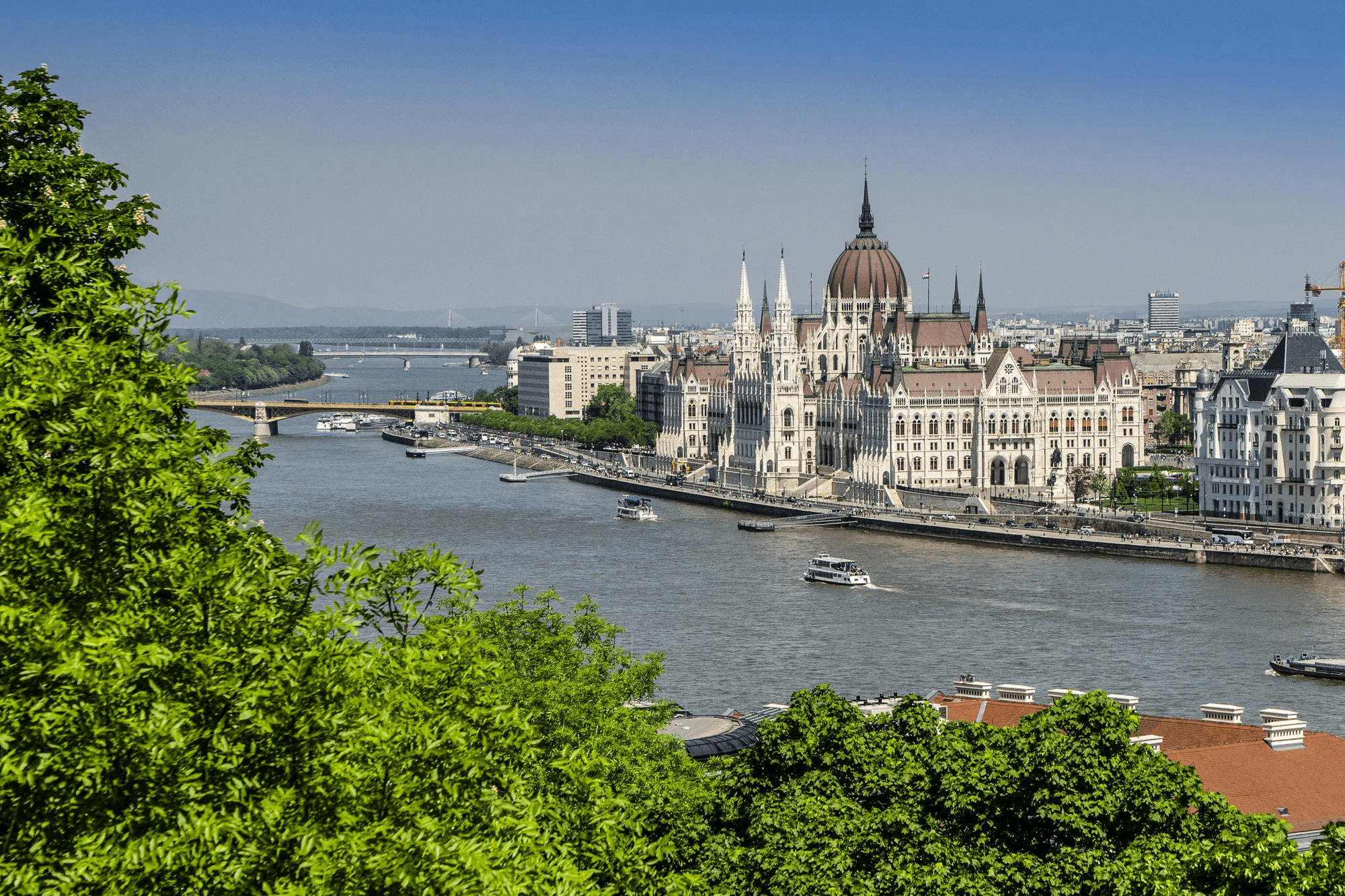 bridge over body of water in front of buildings
