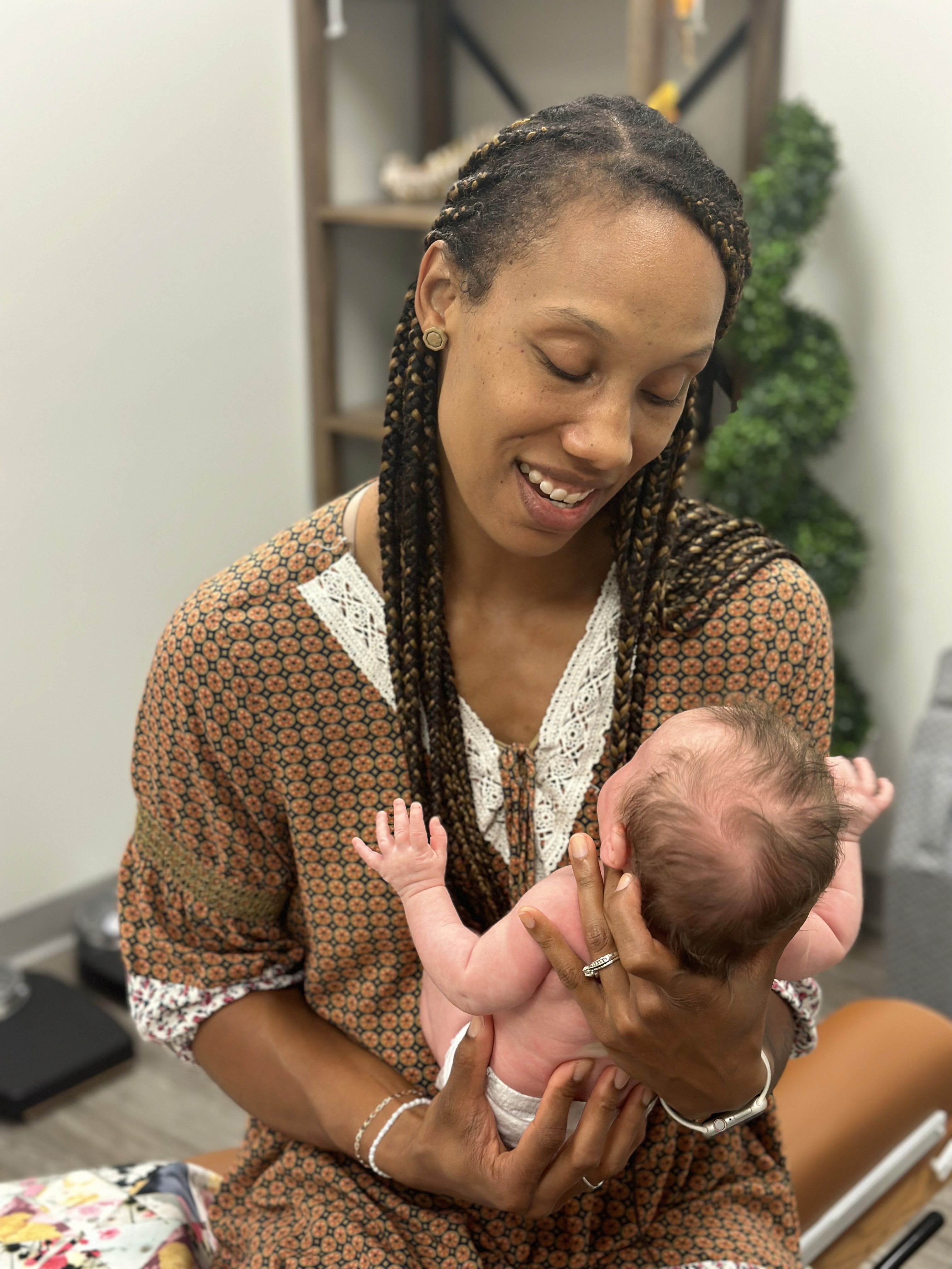 Dr. Ashley holding a baby