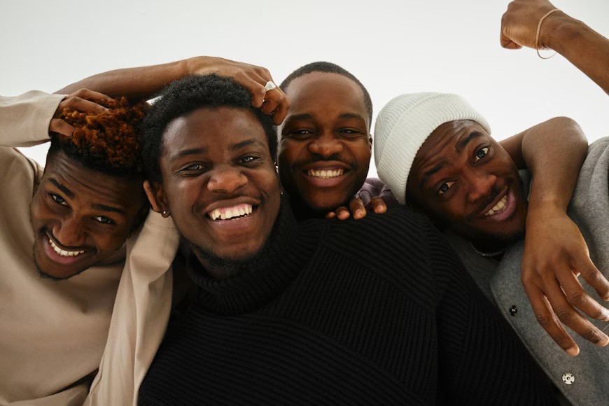 Three children jumping in burlap sacks during a race.