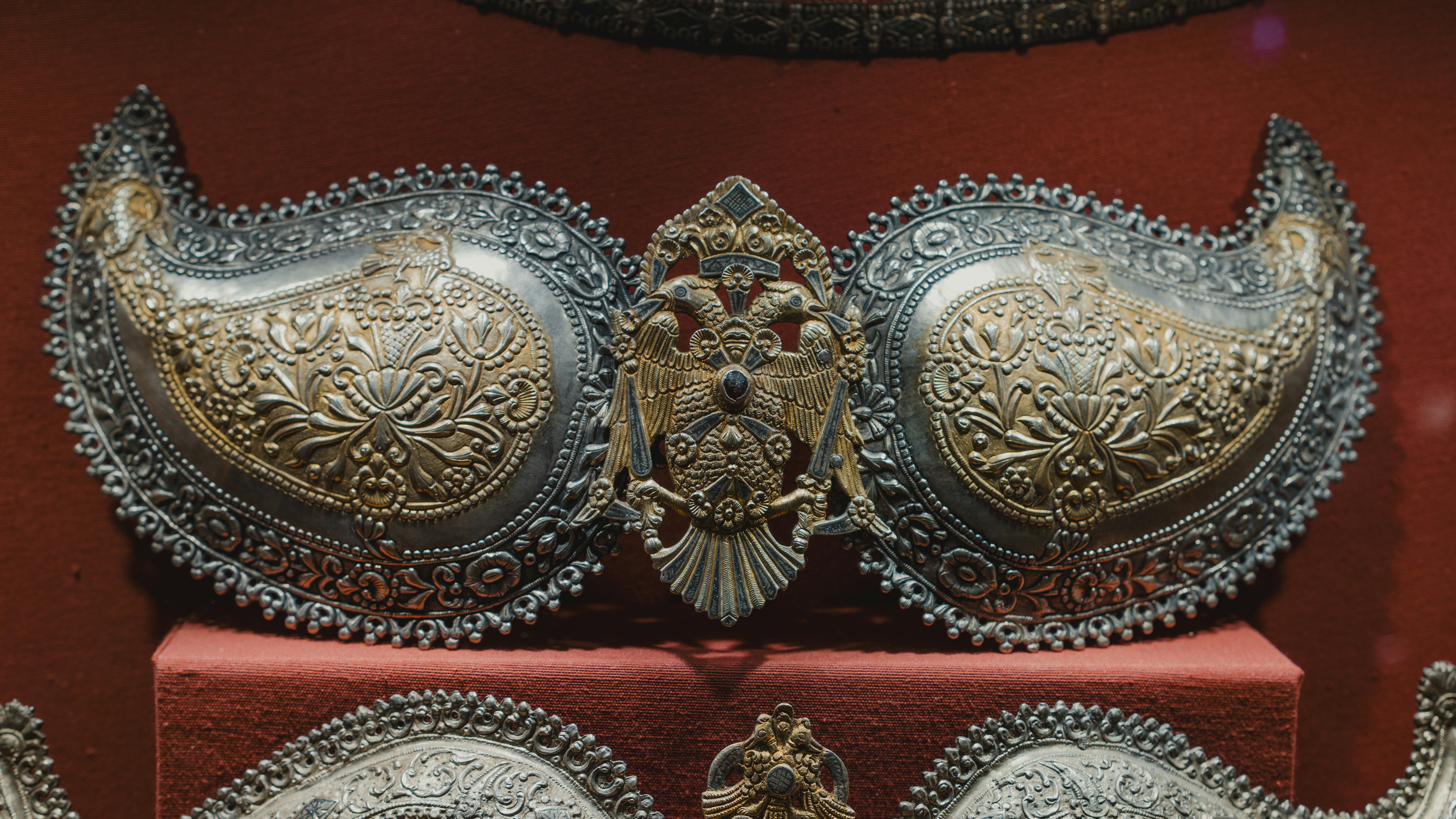 Ornate antique metalwork with paisley motifs