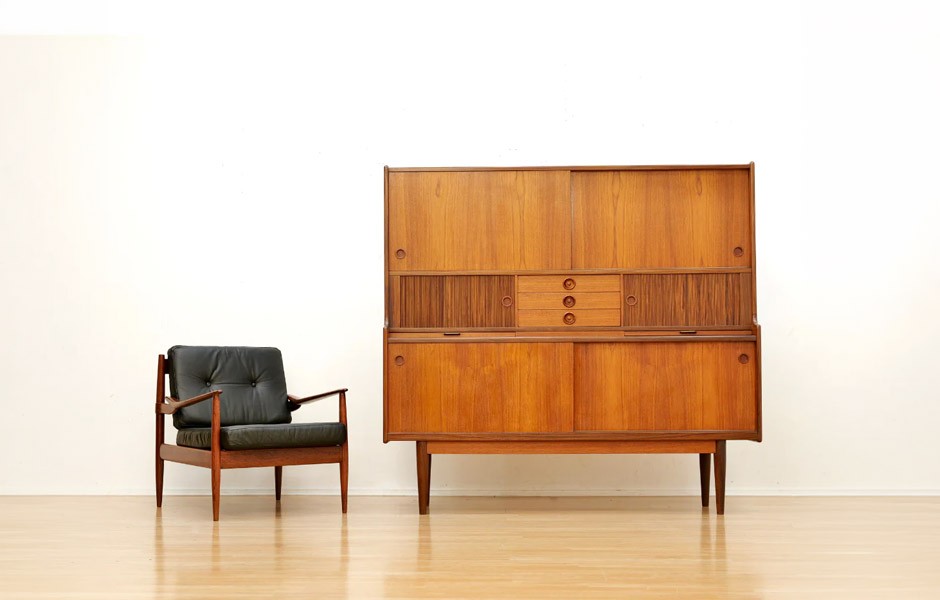 A modern armchair and cabinet.