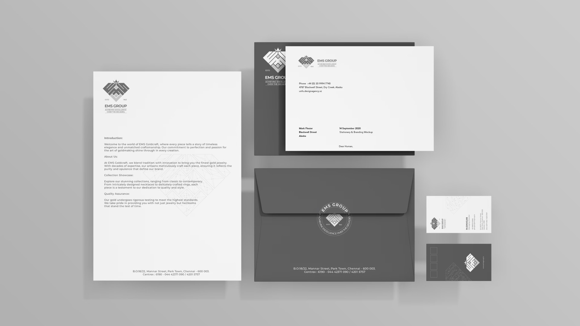 EMS Group branded stationery and letterhead design — Penguincil Design