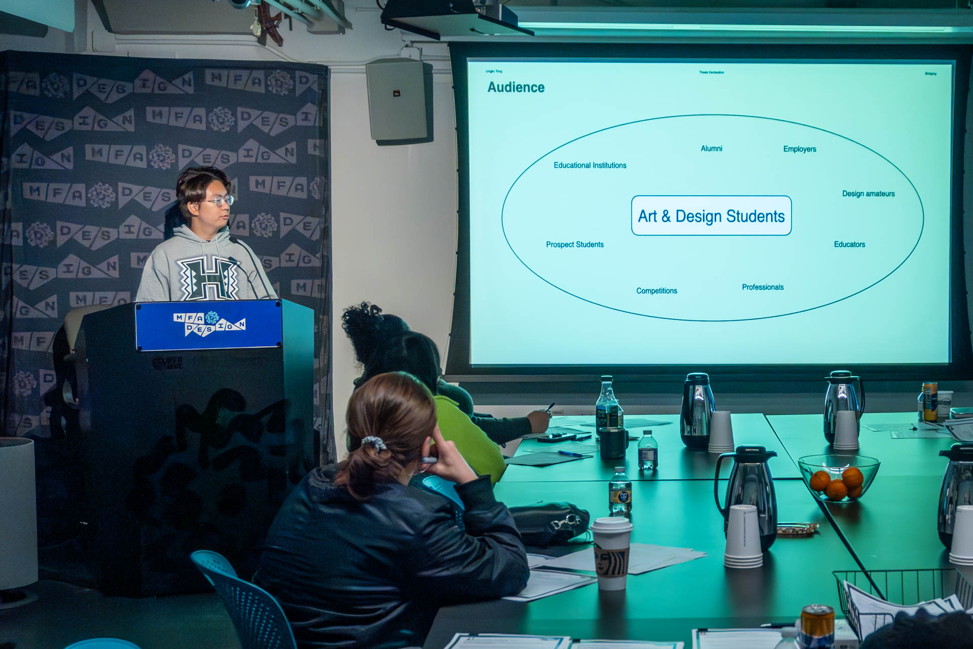 student at a podium giving a presentation