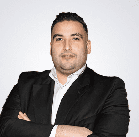 man in gray hoodie wearing black hat