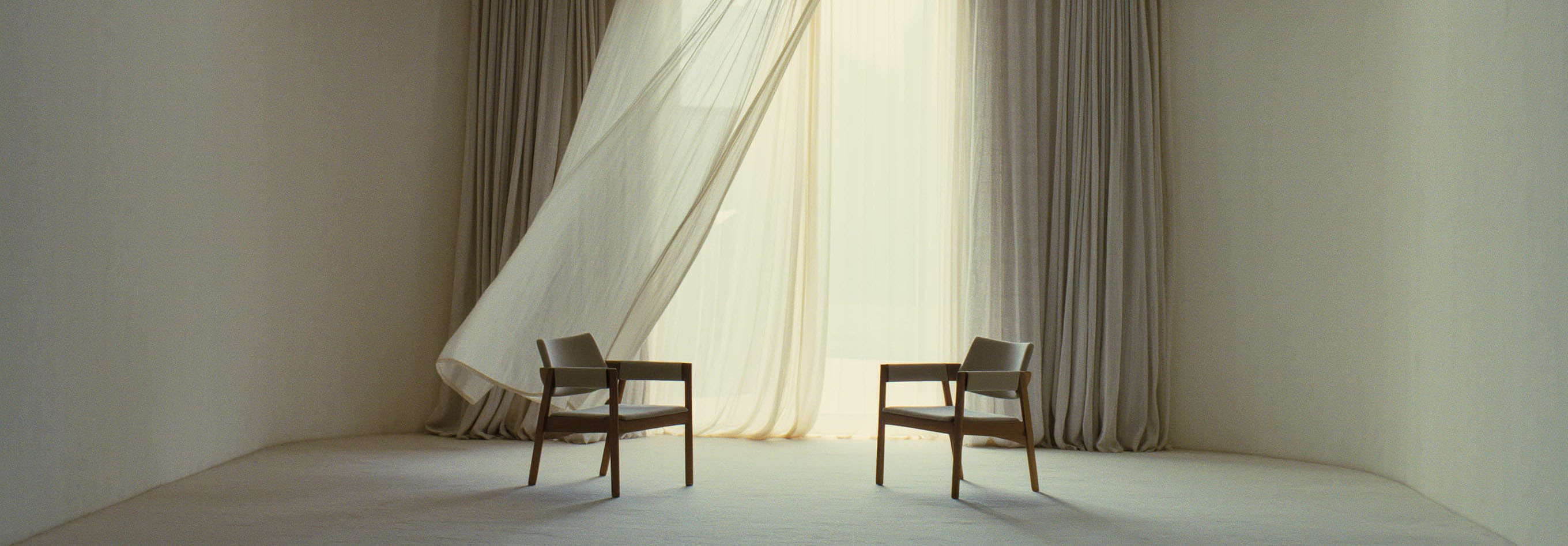Elegant minimalist room with sheer curtains and two armchairs in soft natural light – wedding photographer studio