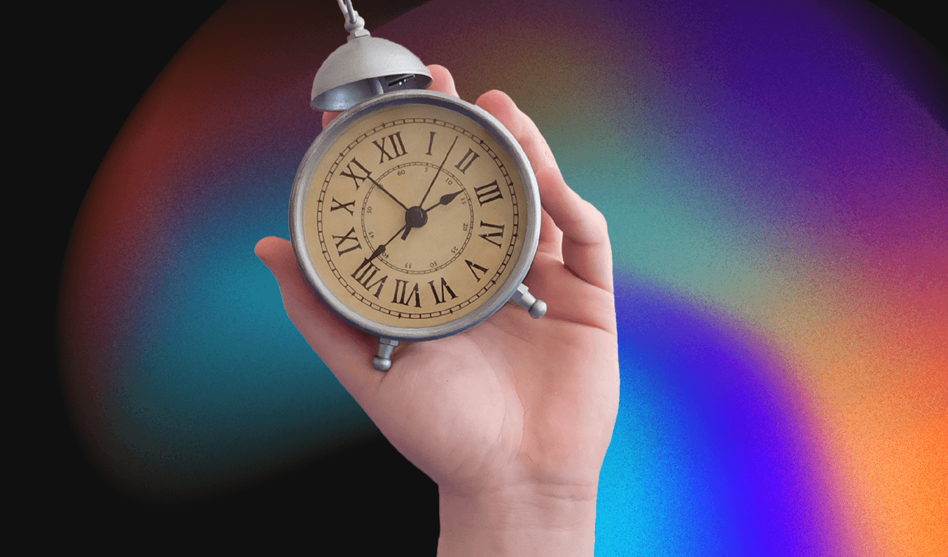 hand holding a clock