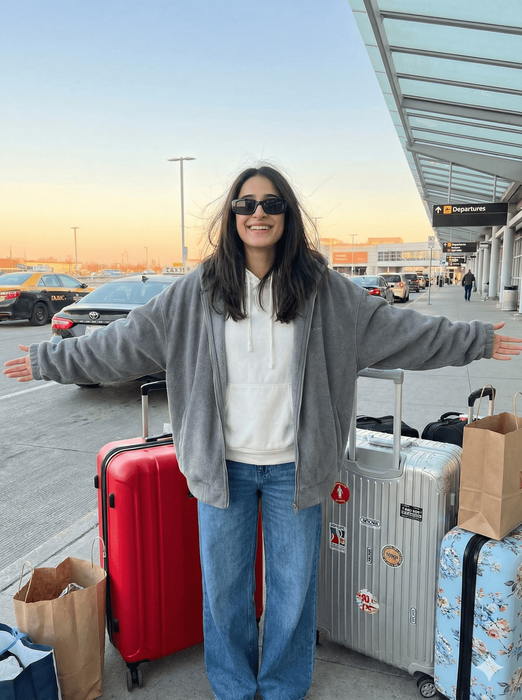 Standing outside airport with luggage