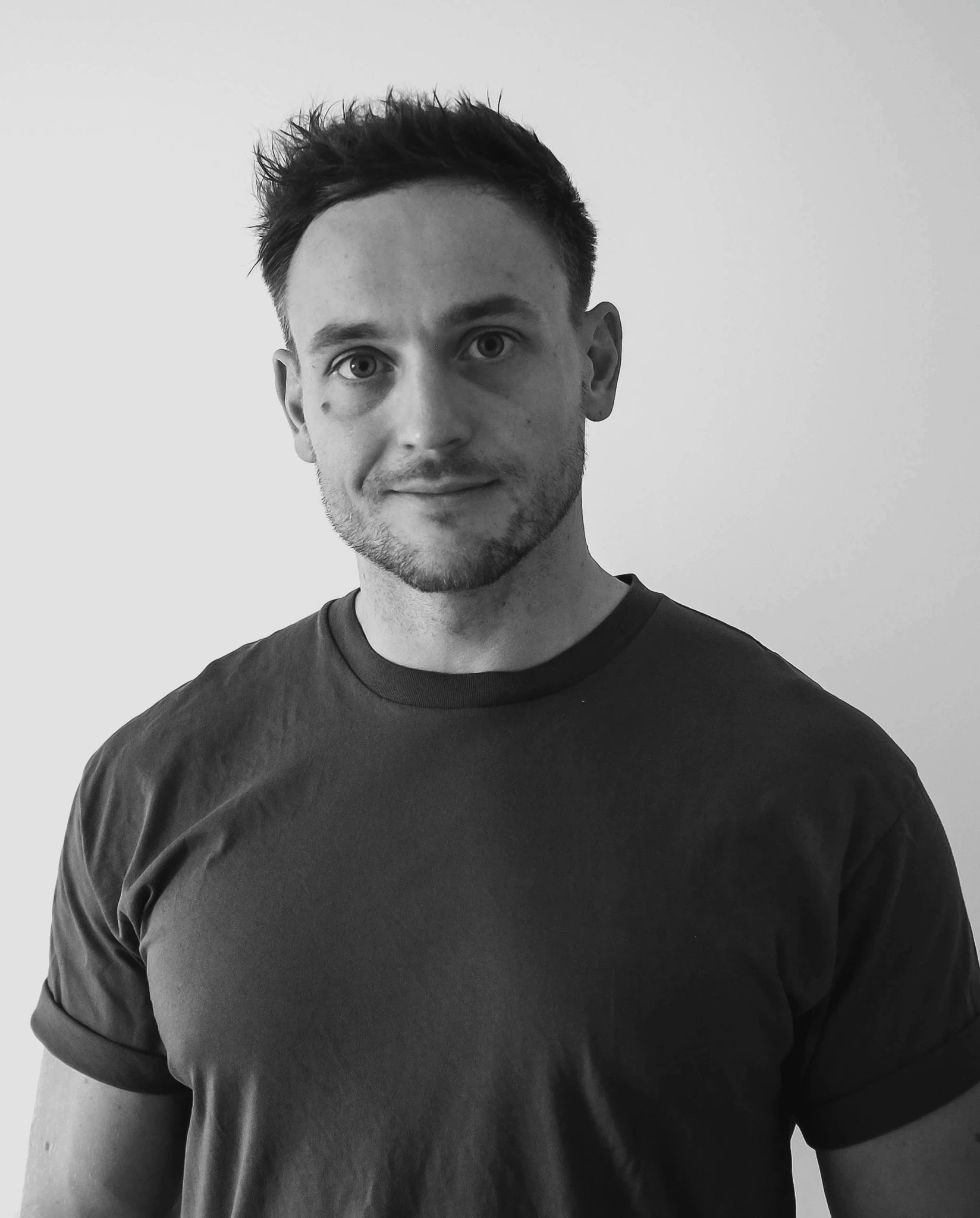 a blurry photo of a person standing in front of a wall