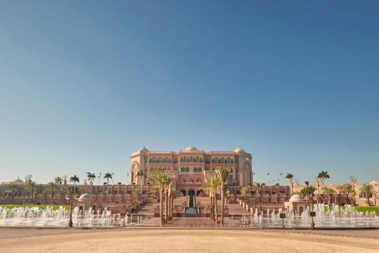 sunloungers fronting buildings near mountain