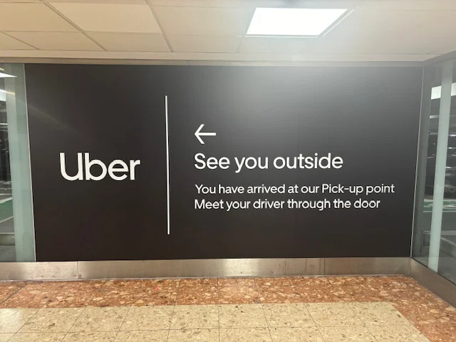 Uber branded board at London Gatwick