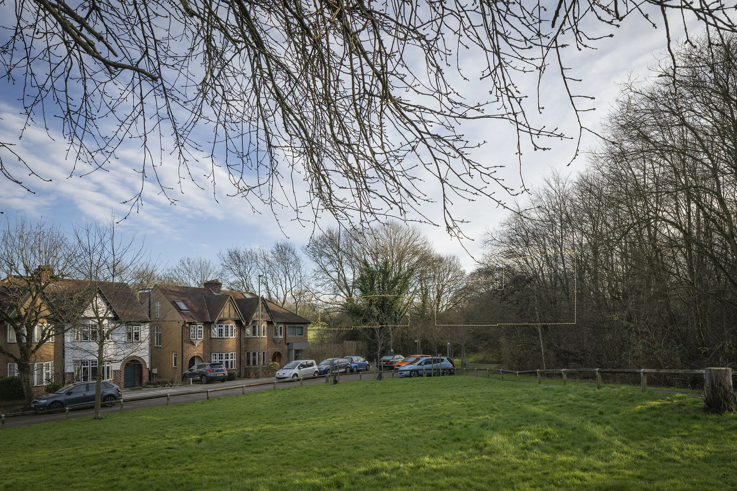 Type 4 AVR Level 1 wireline verified view due south across the open space at Meadway, with the tops of Buildings A and B filtered through the surrounding mature trees.