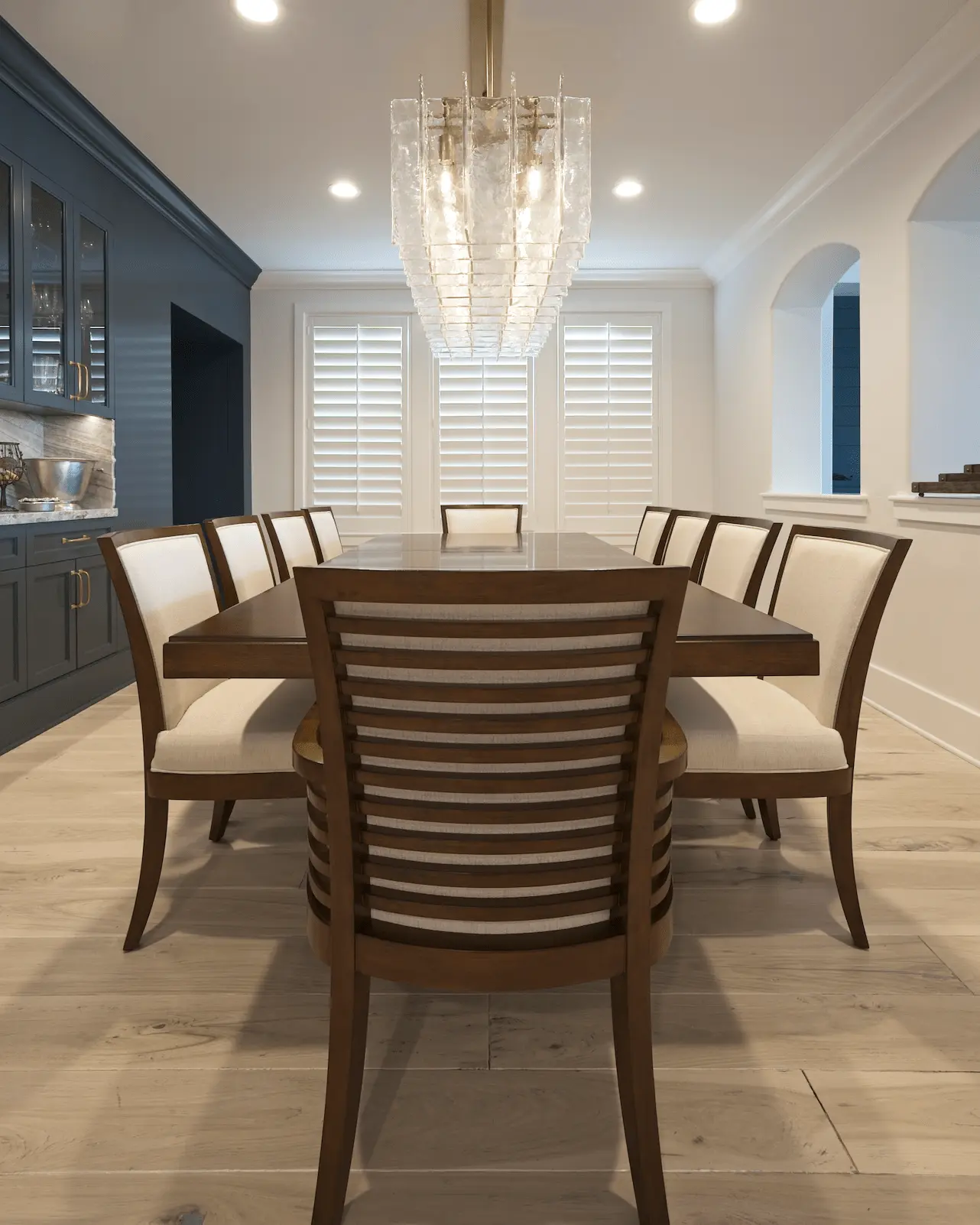 Portrait of the dining room seating arrangement, emphasizing comfort and contemporary coastal style in the Ladera Ranch Remodel. Photo by Todd Huge.
