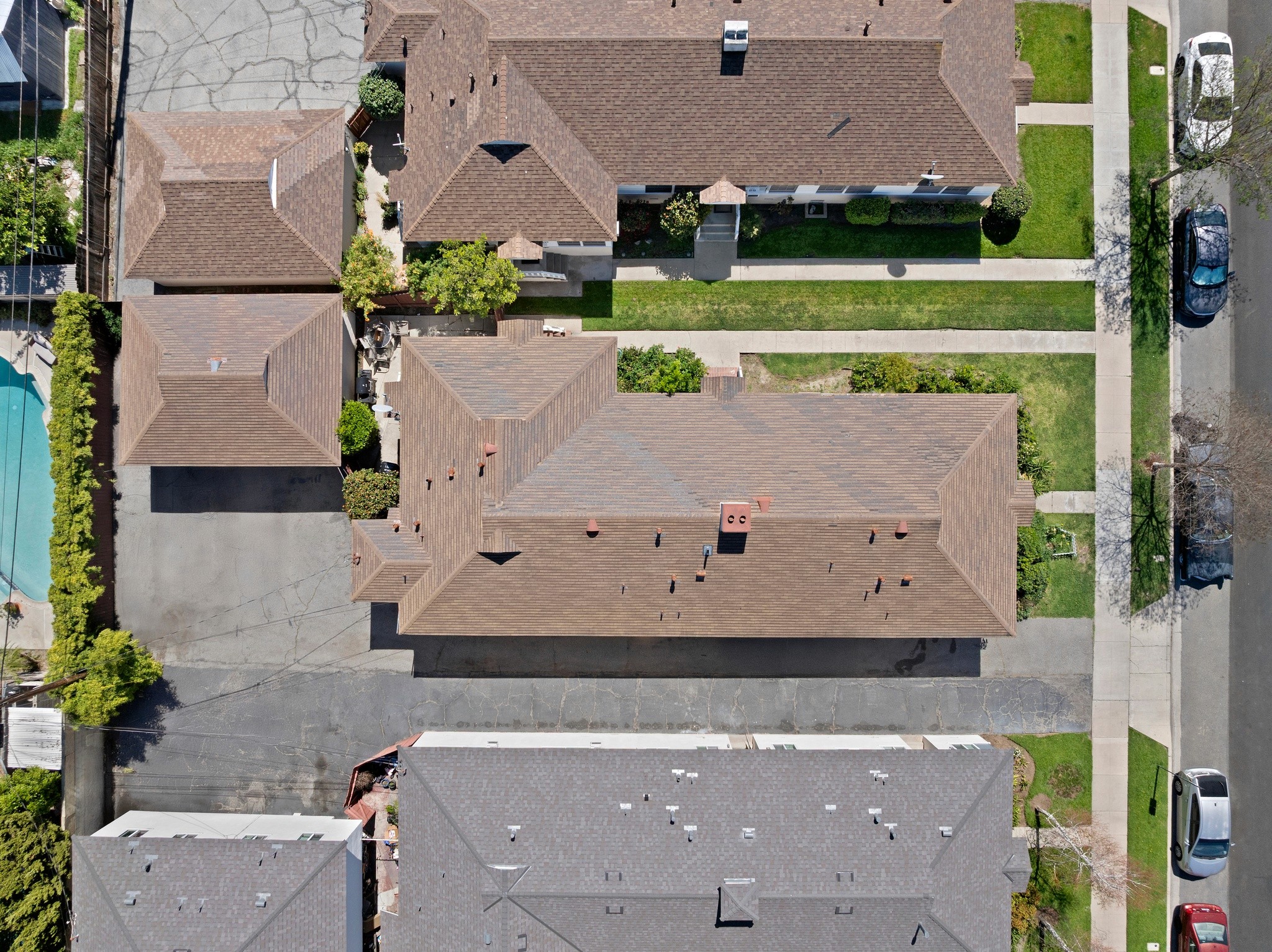 Overhead aerial showing duplex layout, garages, and lot configuration at 242 N Cordova property.