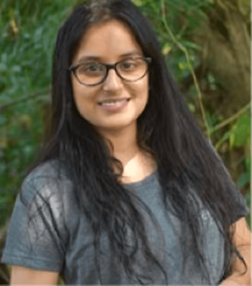 woman wearing eyeglasses reading book