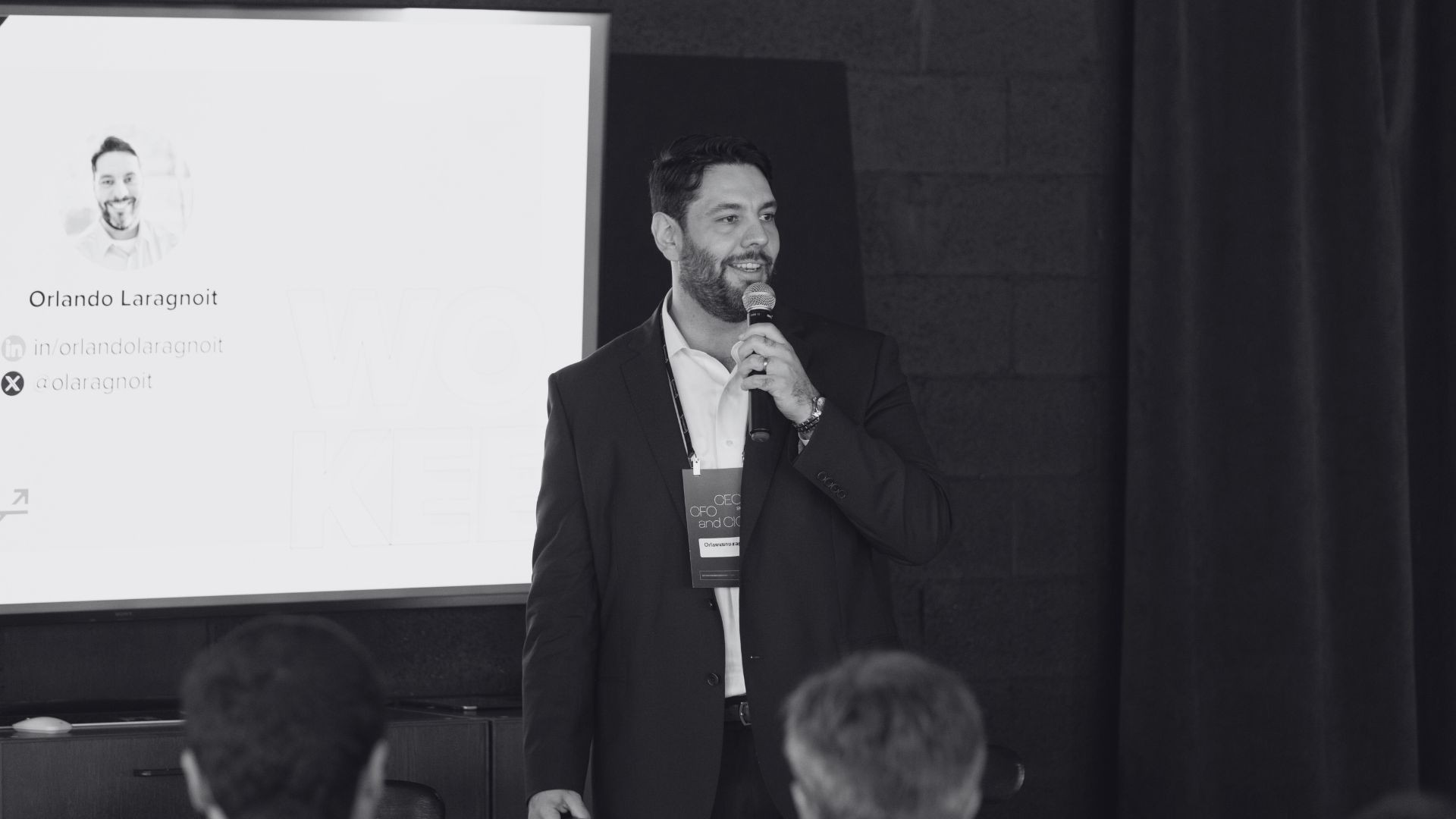 person sitting in a chair in front of a man