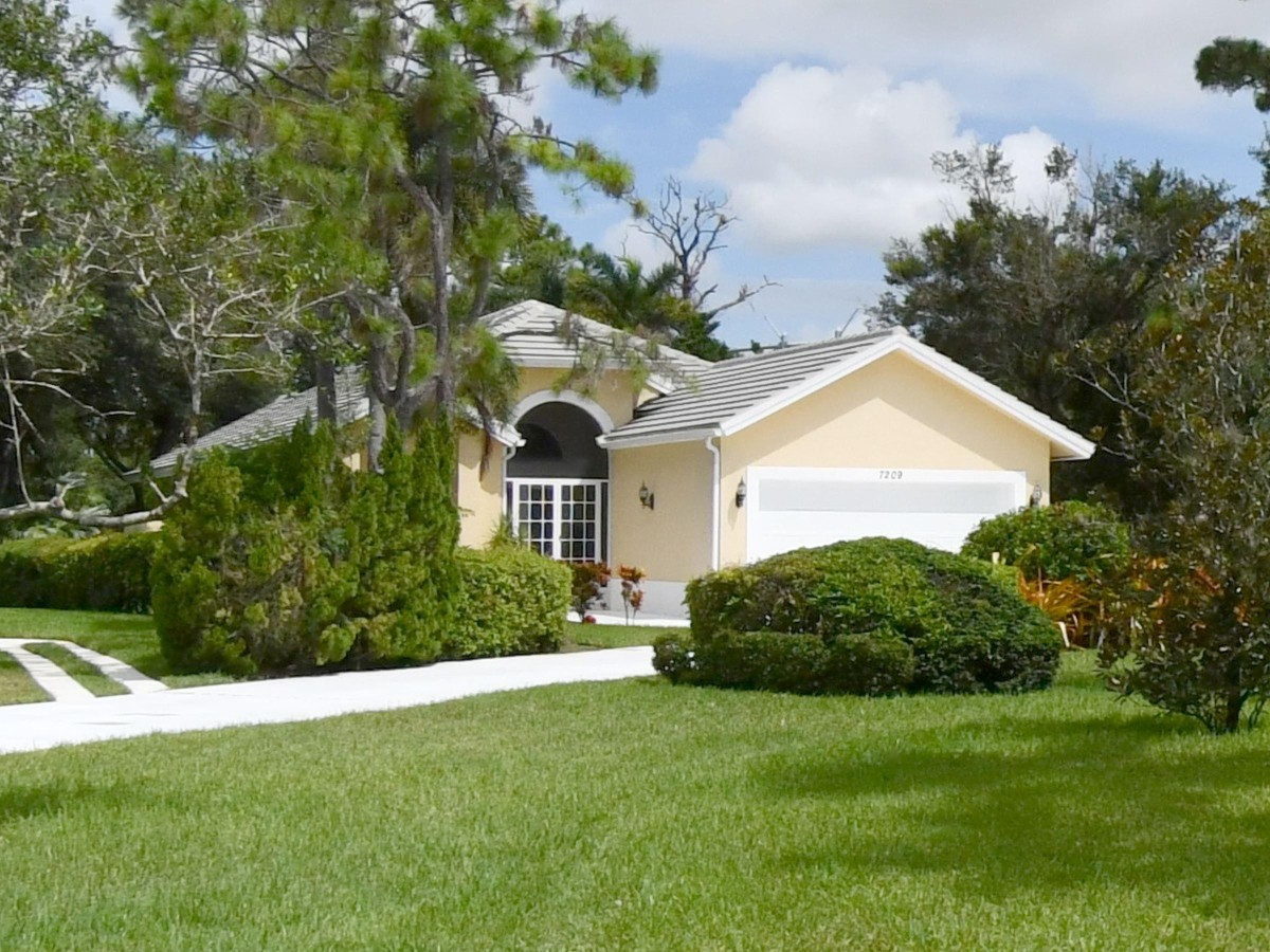 1995 New Roof Construction in Marsh Landing, PGA Village, Port St Lucie with Entegra Flat Broomswept Tile in Natural Gray