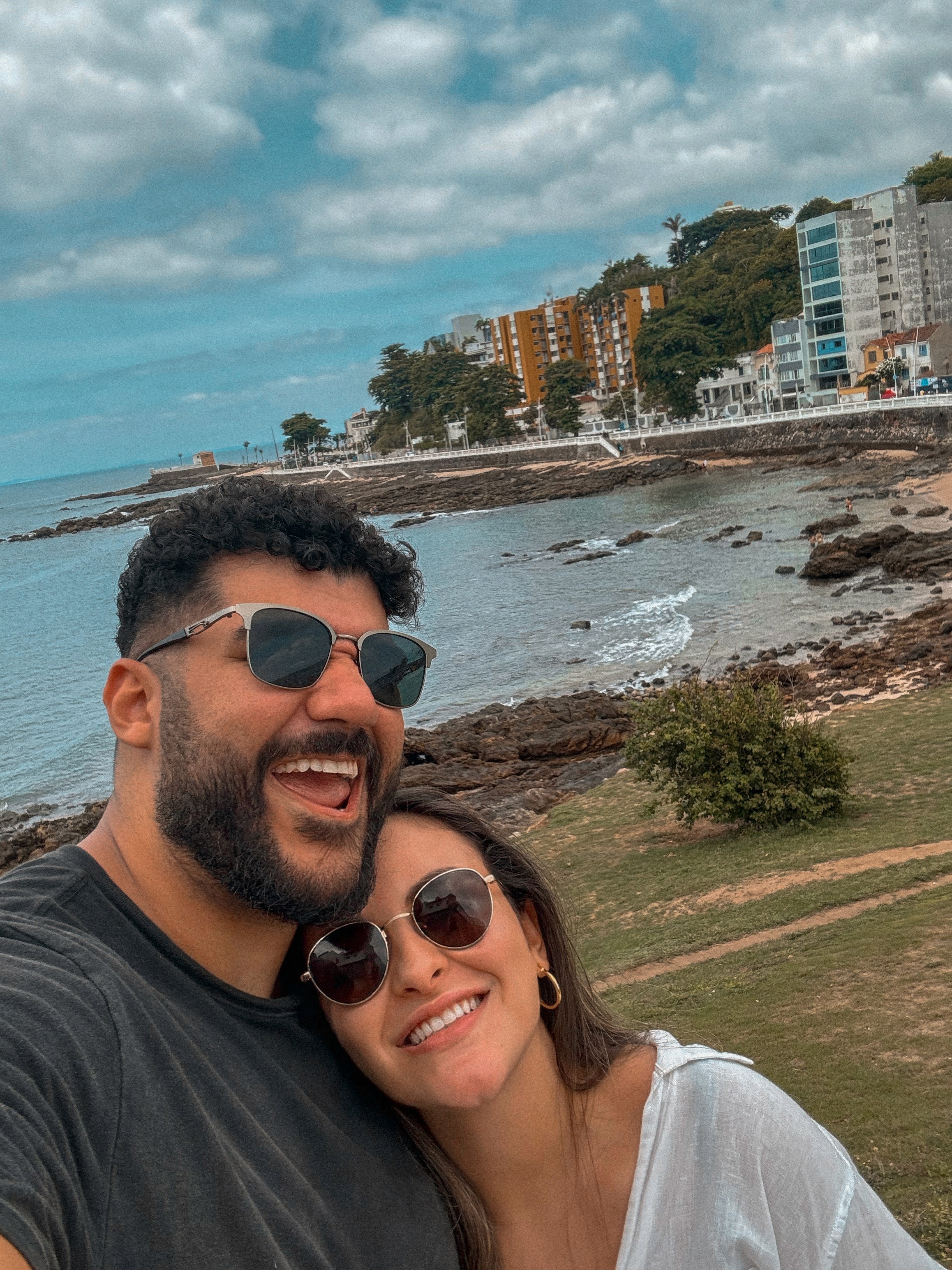 Couple portrait with dog on field
