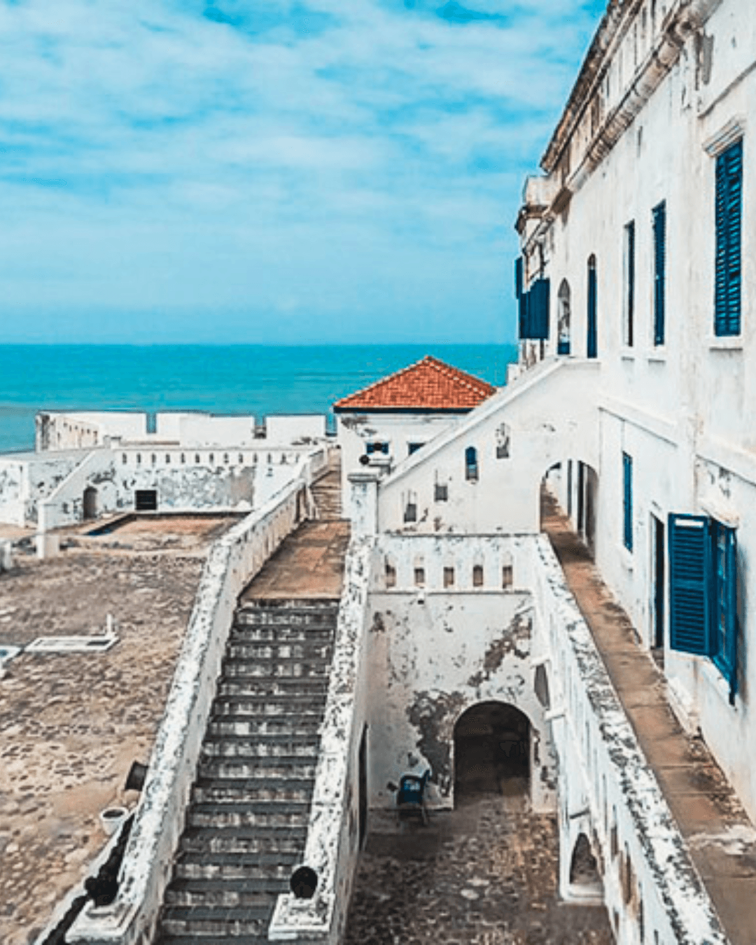 people walking near white concrete building during daytime